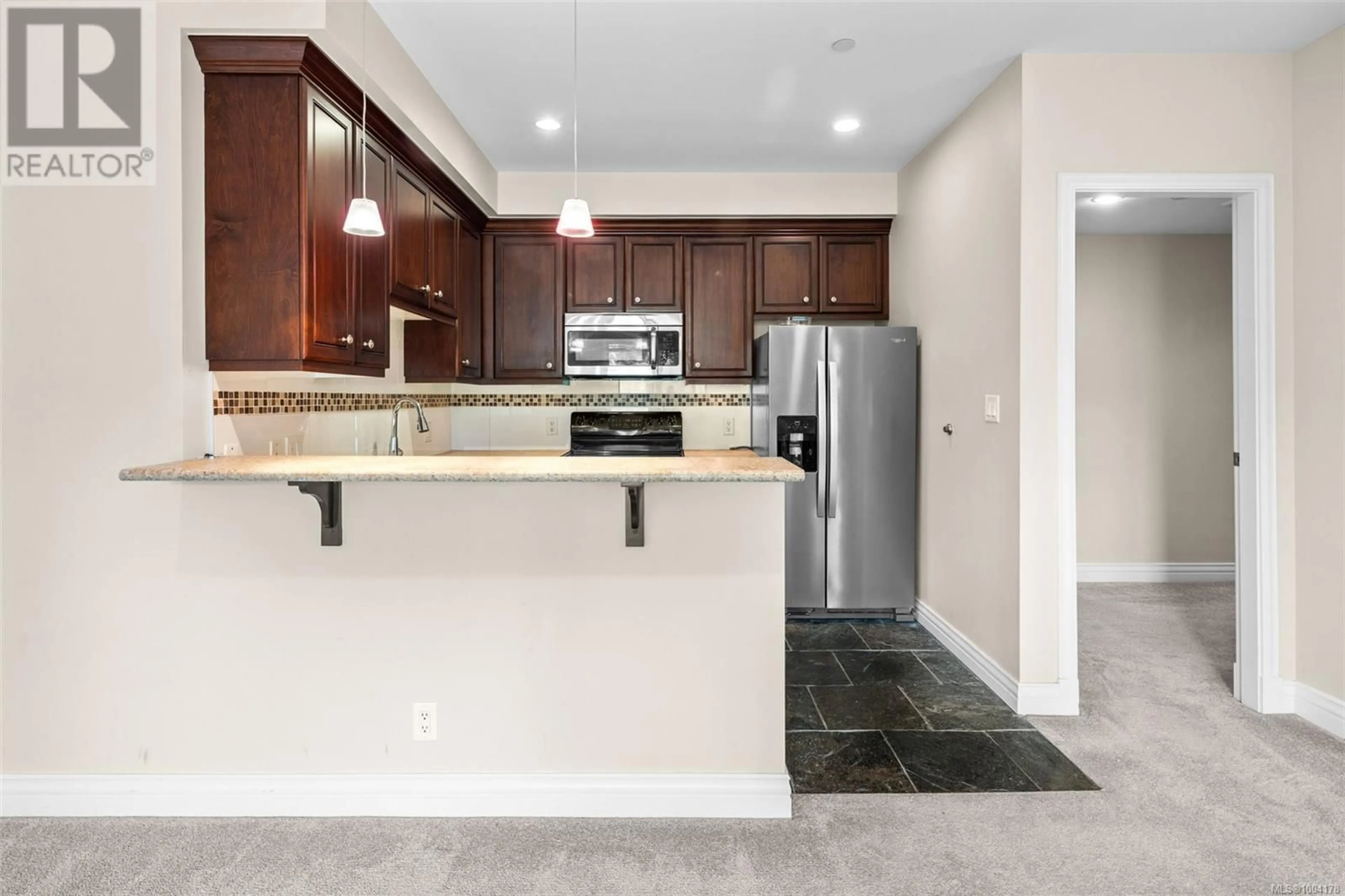 Open concept kitchen, ceramic/tile floor for 311 - 1335 BEAR MOUNTAIN PARKWAY, Langford British Columbia V9B6T9