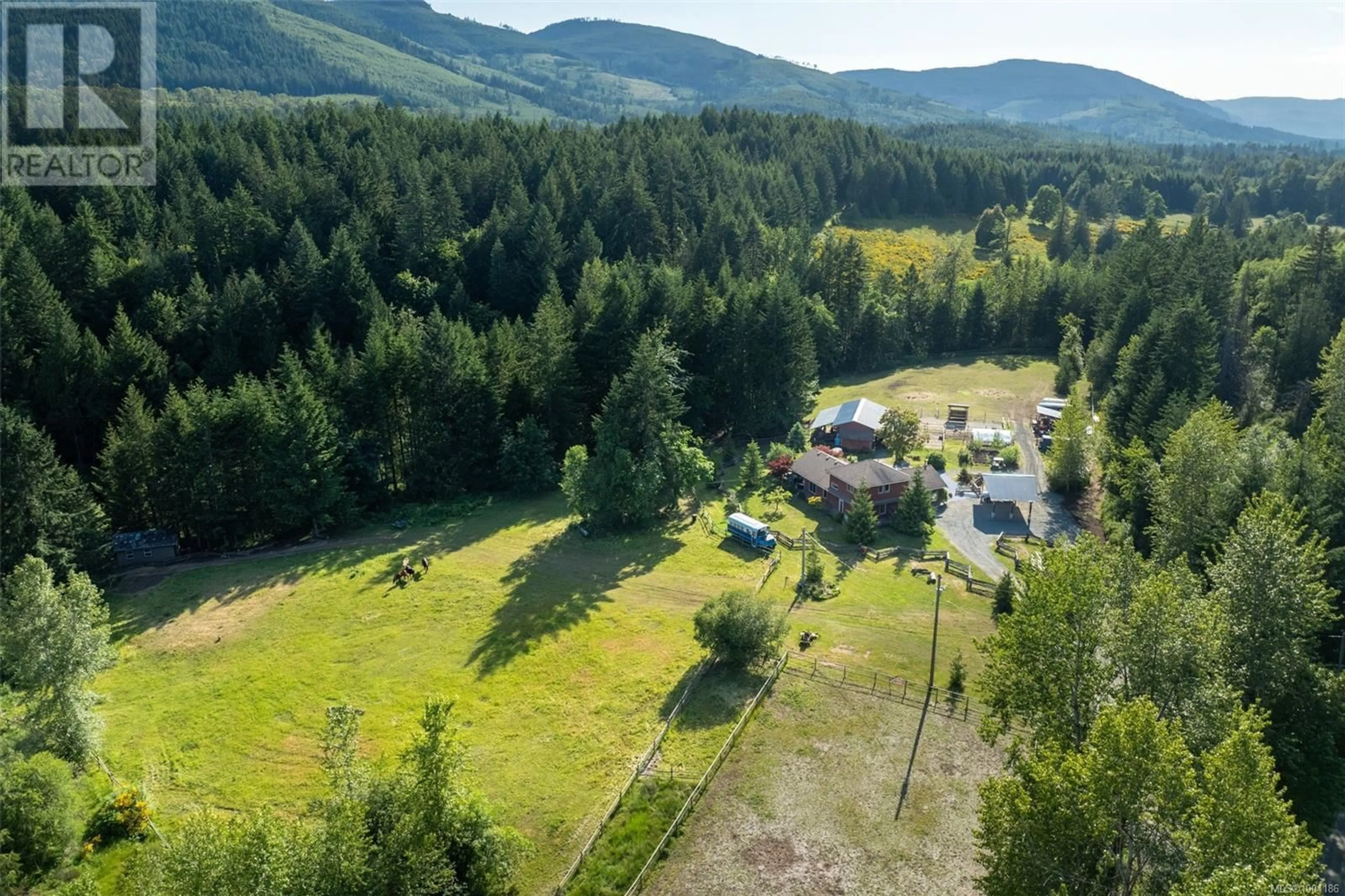 A pic from outside/outdoor area/front of a property/back of a property/a pic from drone, forest/trees view for 3700 HANKINS ROAD, Duncan British Columbia V9L6T2