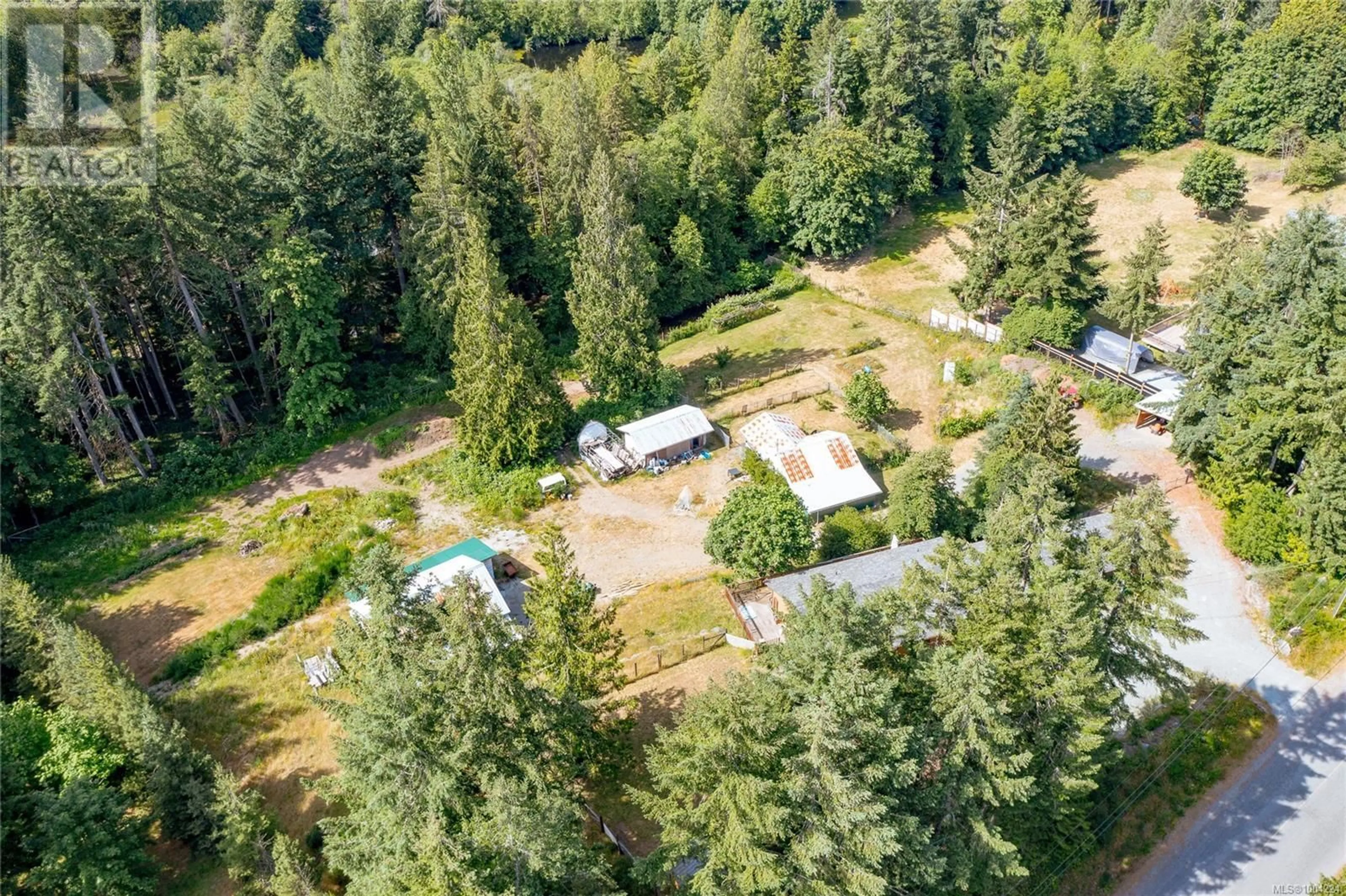 A pic from outside/outdoor area/front of a property/back of a property/a pic from drone, forest/trees view for 5036 CULVERTON ROAD, Duncan British Columbia V9L6H4