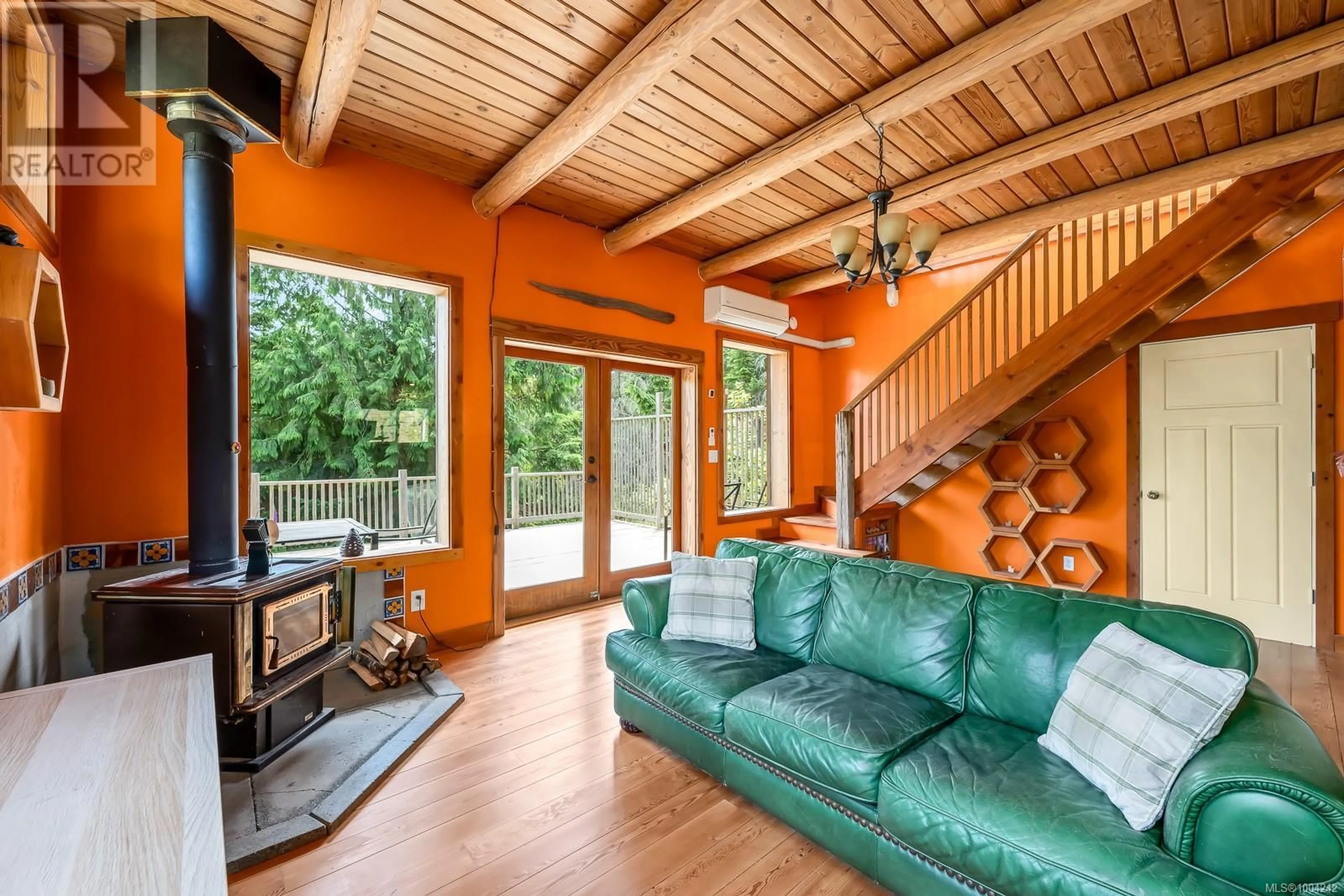 Living room with furniture, wood/laminate floor for 2350 CHICKADEE ROAD, Denman Island British Columbia V0R1T0