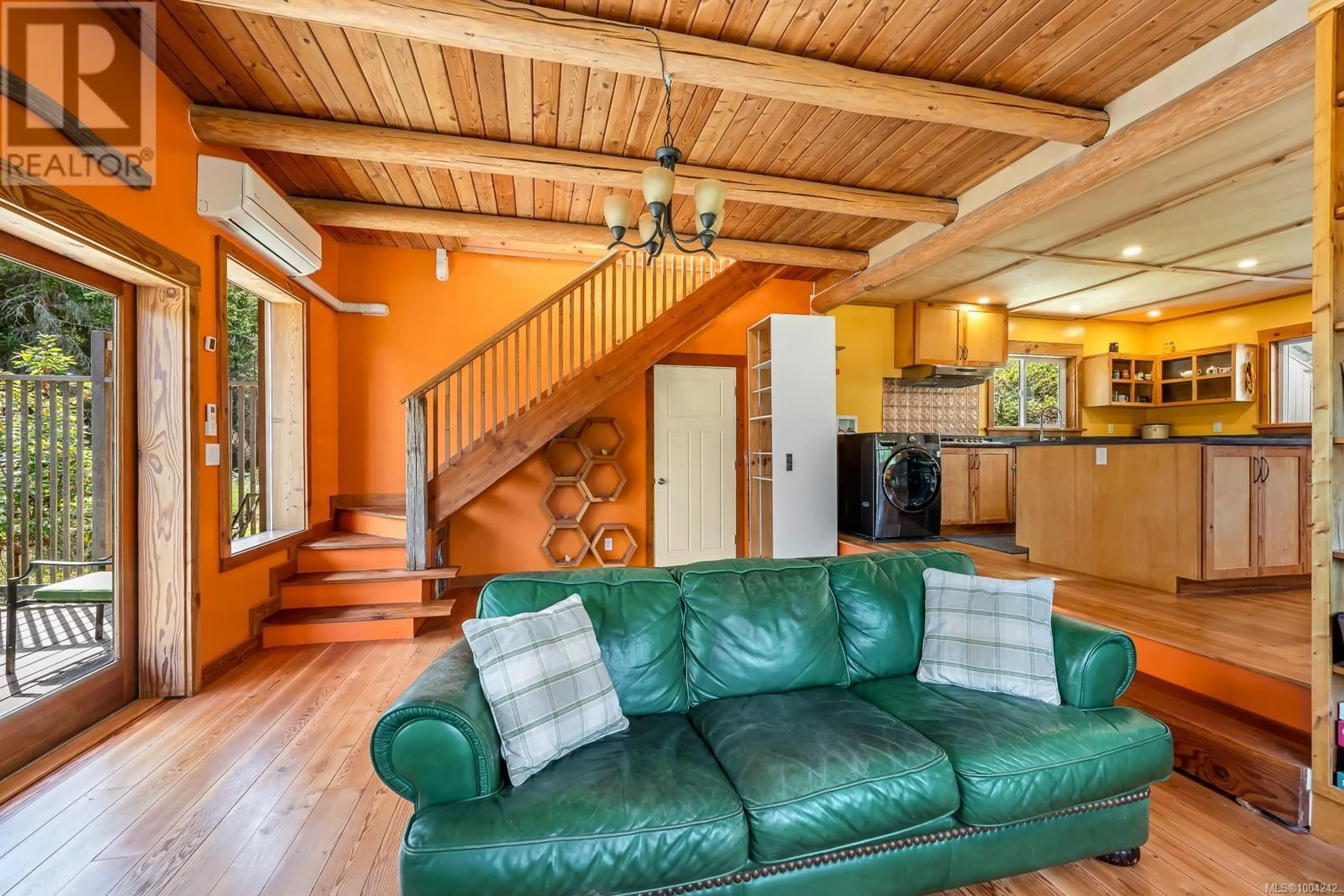 Living room with furniture, wood/laminate floor for 2350 CHICKADEE ROAD, Denman Island British Columbia V0R1T0