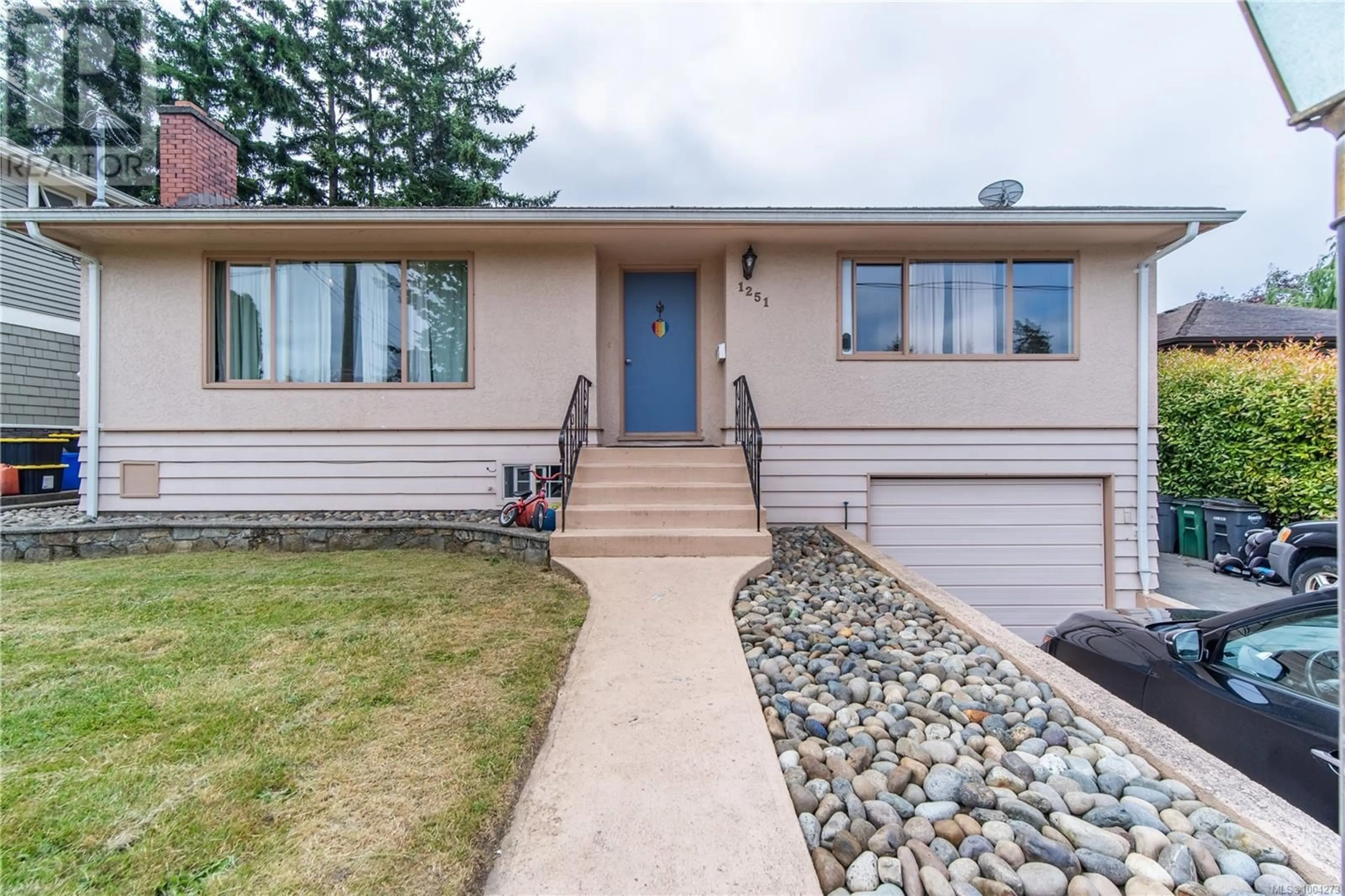 Home with vinyl exterior material, street for 1251 GARKIL ROAD, Saanich British Columbia V8P2L2
