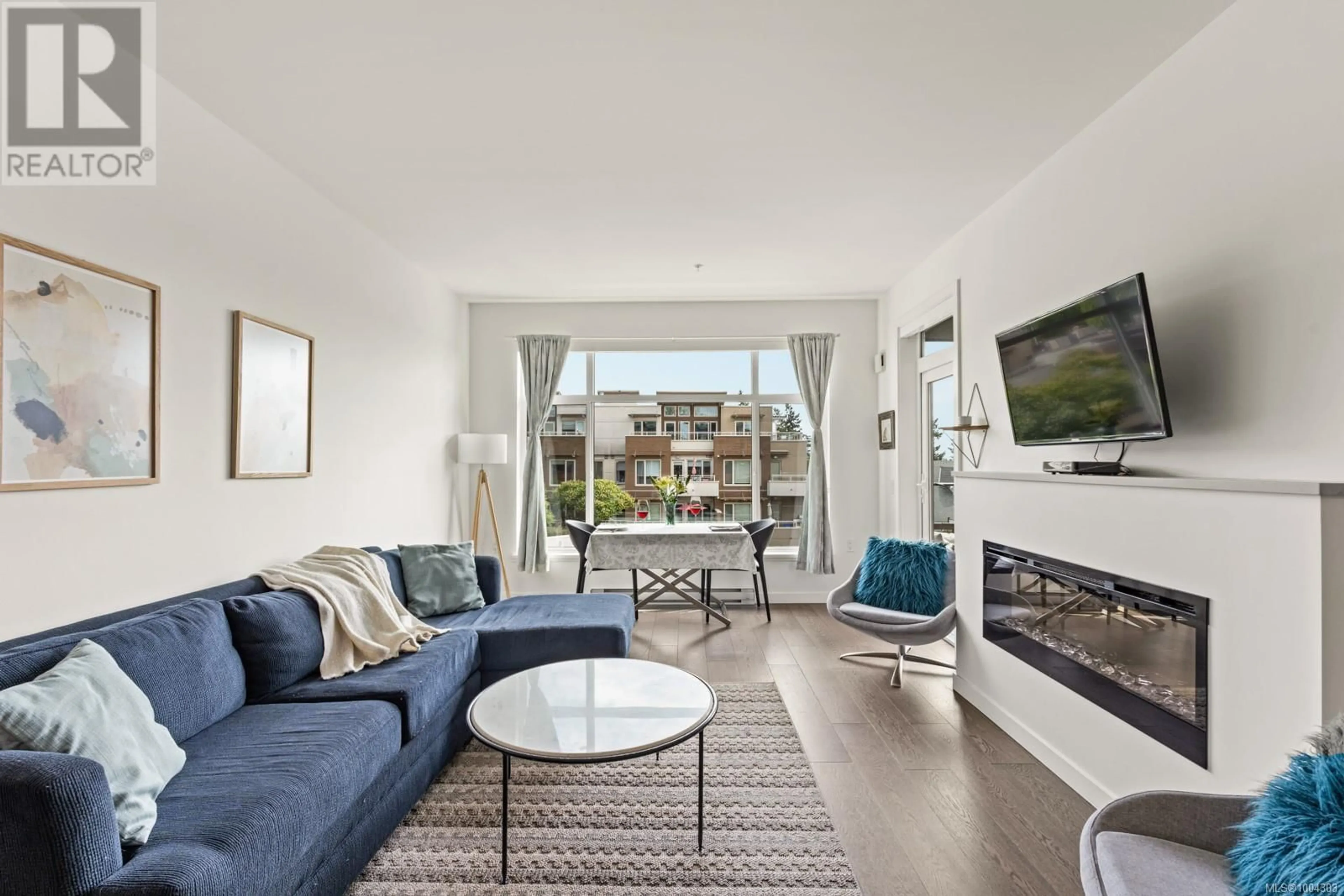 Living room with furniture, unknown for 403 - 7162 WEST SAANICH ROAD, Central Saanich British Columbia V8M1P6