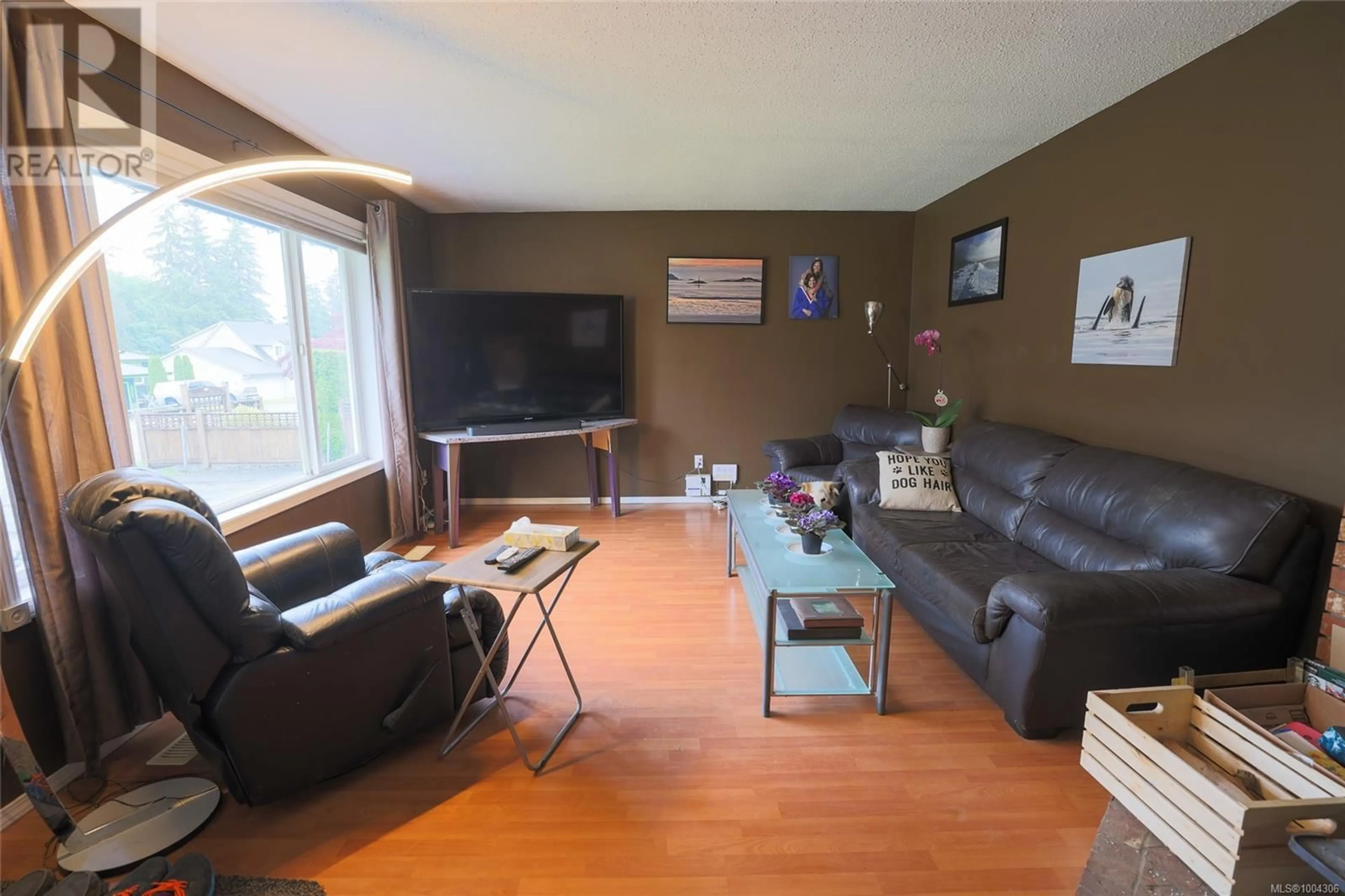 Living room with furniture, wood/laminate floor for 9395 ELK DRIVE, Port Hardy British Columbia V0N2P0