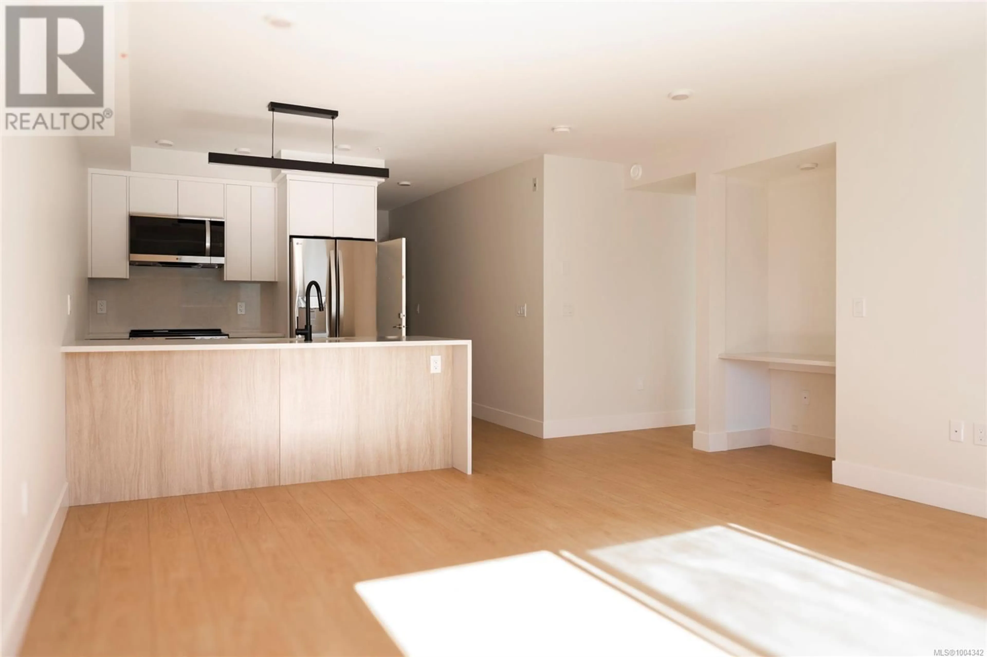 Open concept kitchen, wood/laminate floor for 301 - 45 HALIBURTON STREET, Nanaimo British Columbia V9R4V6