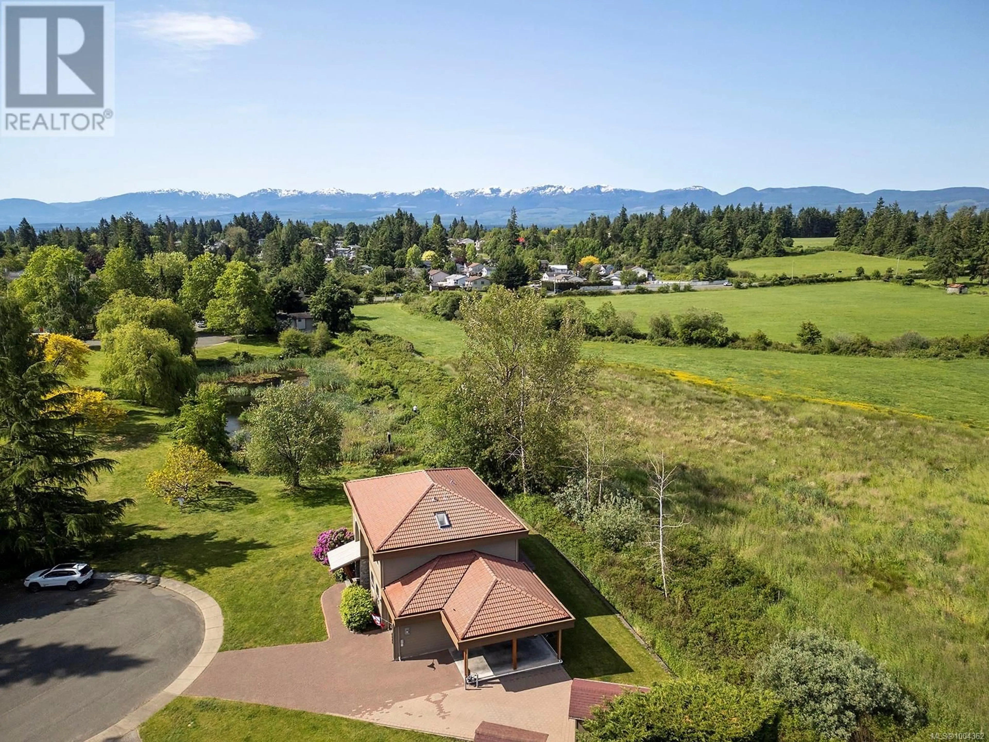 A pic from outside/outdoor area/front of a property/back of a property/a pic from drone, mountain view for 1675 CHESTER PLACE, Comox British Columbia V9M1A9
