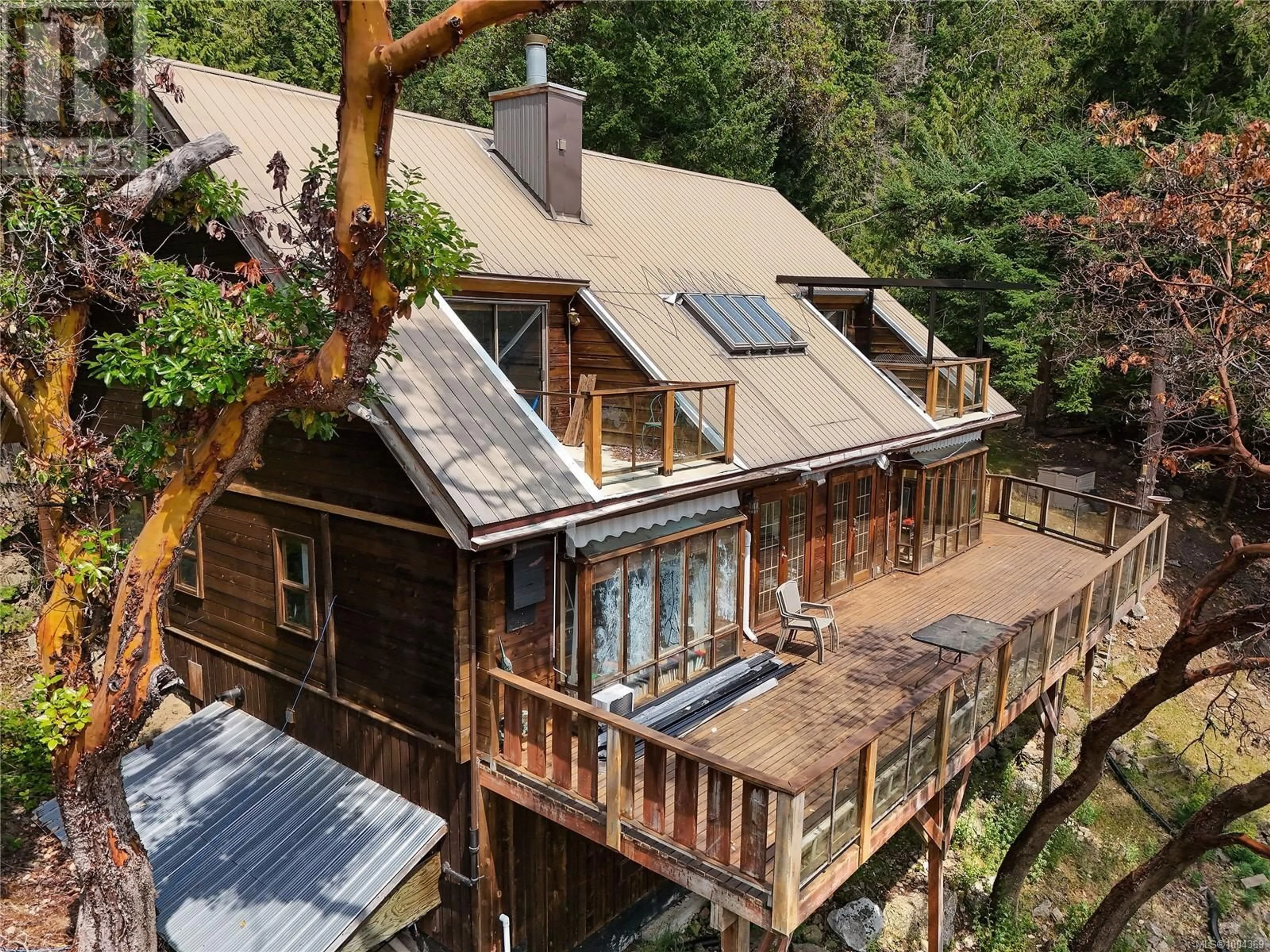 A pic from outside/outdoor area/front of a property/back of a property/a pic from drone, forest/trees view for 330 EAST WEST ROAD, Mayne Island British Columbia V0N2J2