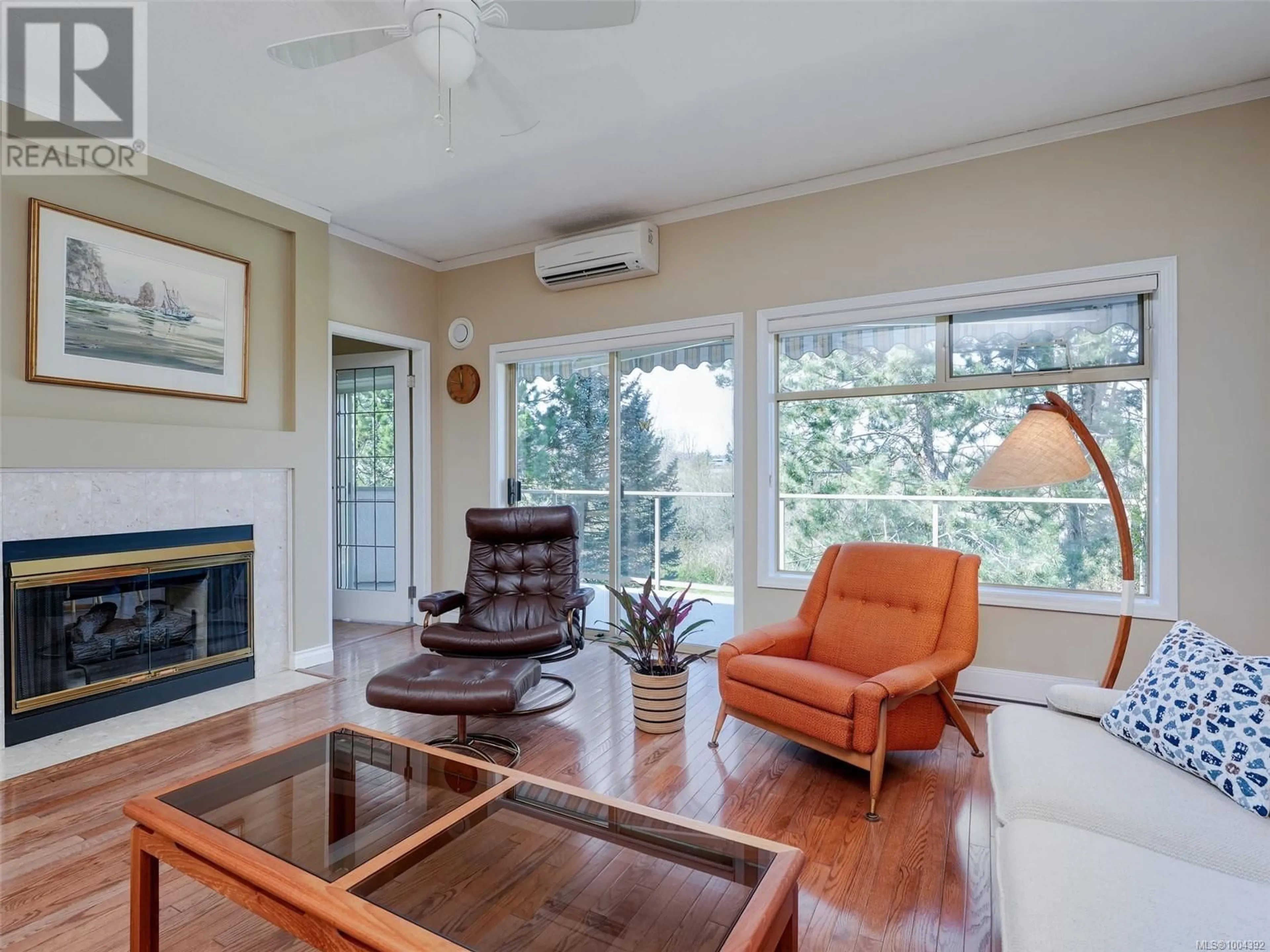 Living room with furniture, wood/laminate floor for 47 - 4318 EMILY CARR DRIVE, Saanich British Columbia V8X5E7