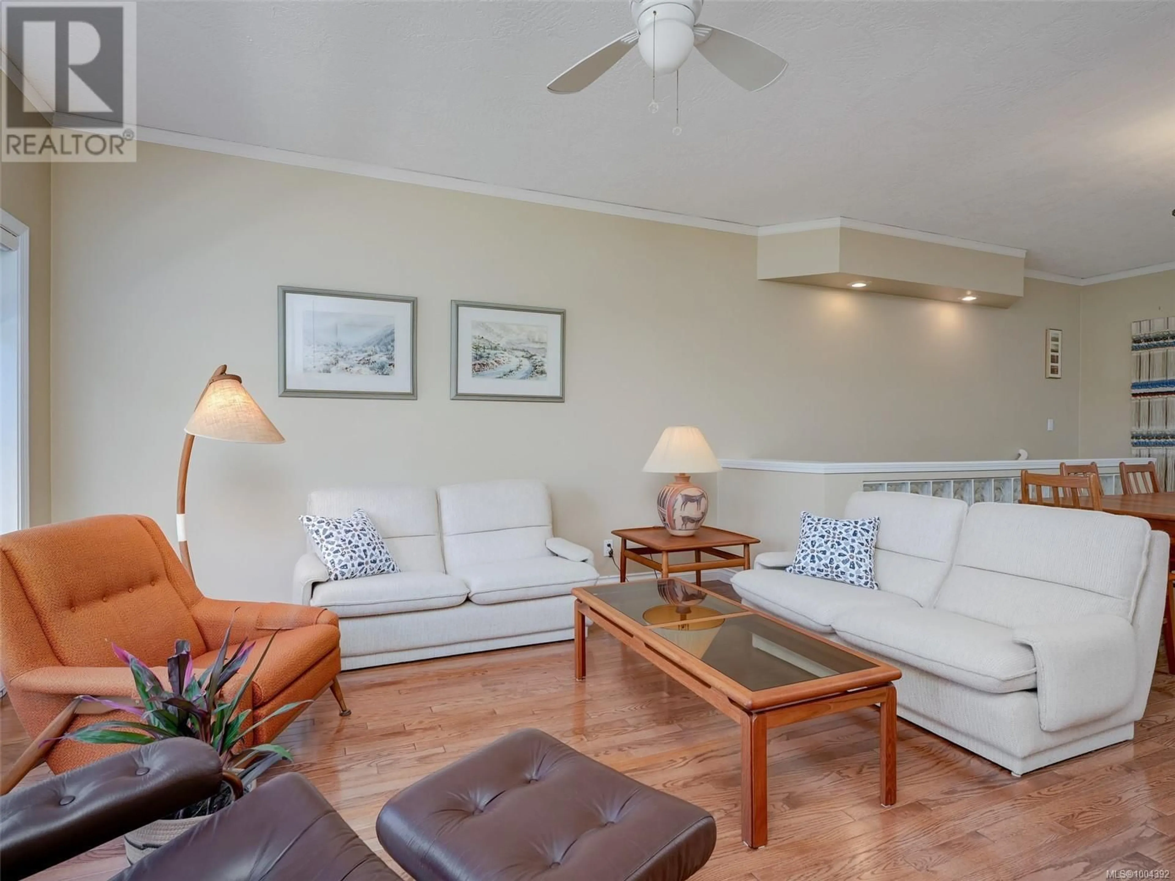 Living room with furniture, wood/laminate floor for 47 - 4318 EMILY CARR DRIVE, Saanich British Columbia V8X5E7