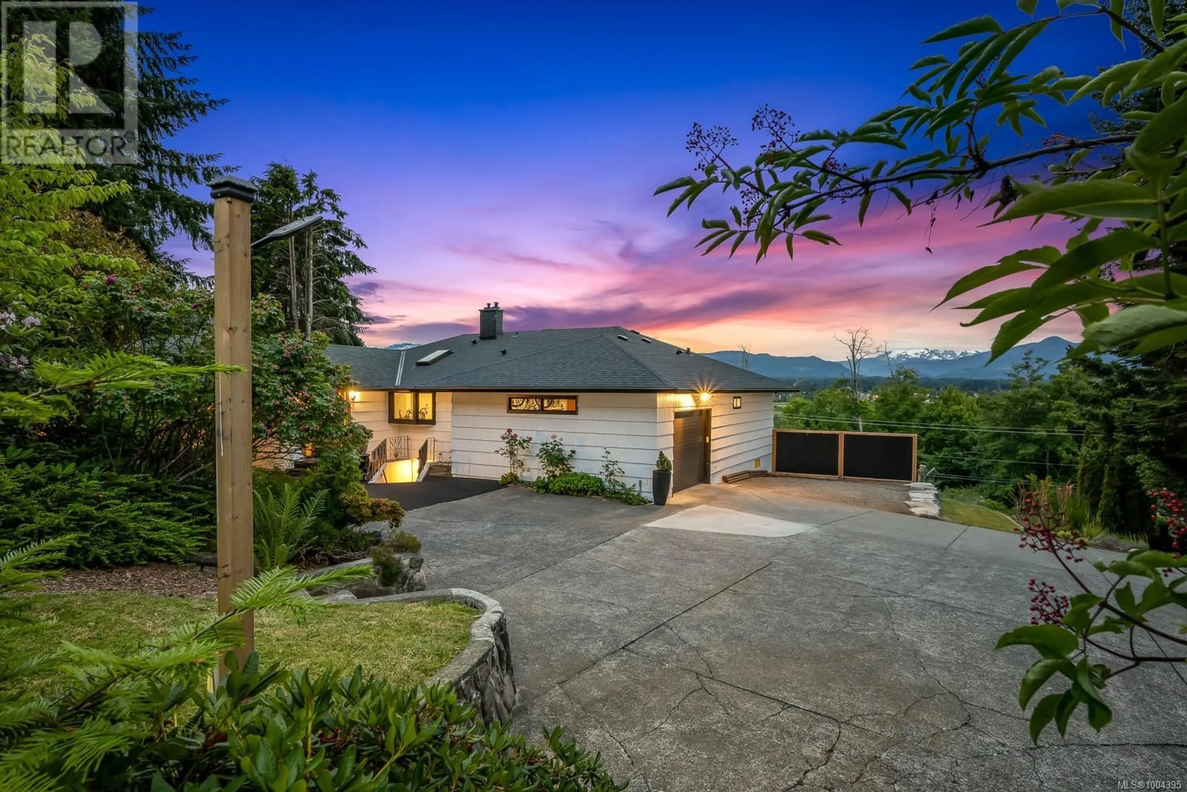 A pic from outside/outdoor area/front of a property/back of a property/a pic from drone, mountain view for 1880 BACK ROAD, Courtenay British Columbia V9N9C4