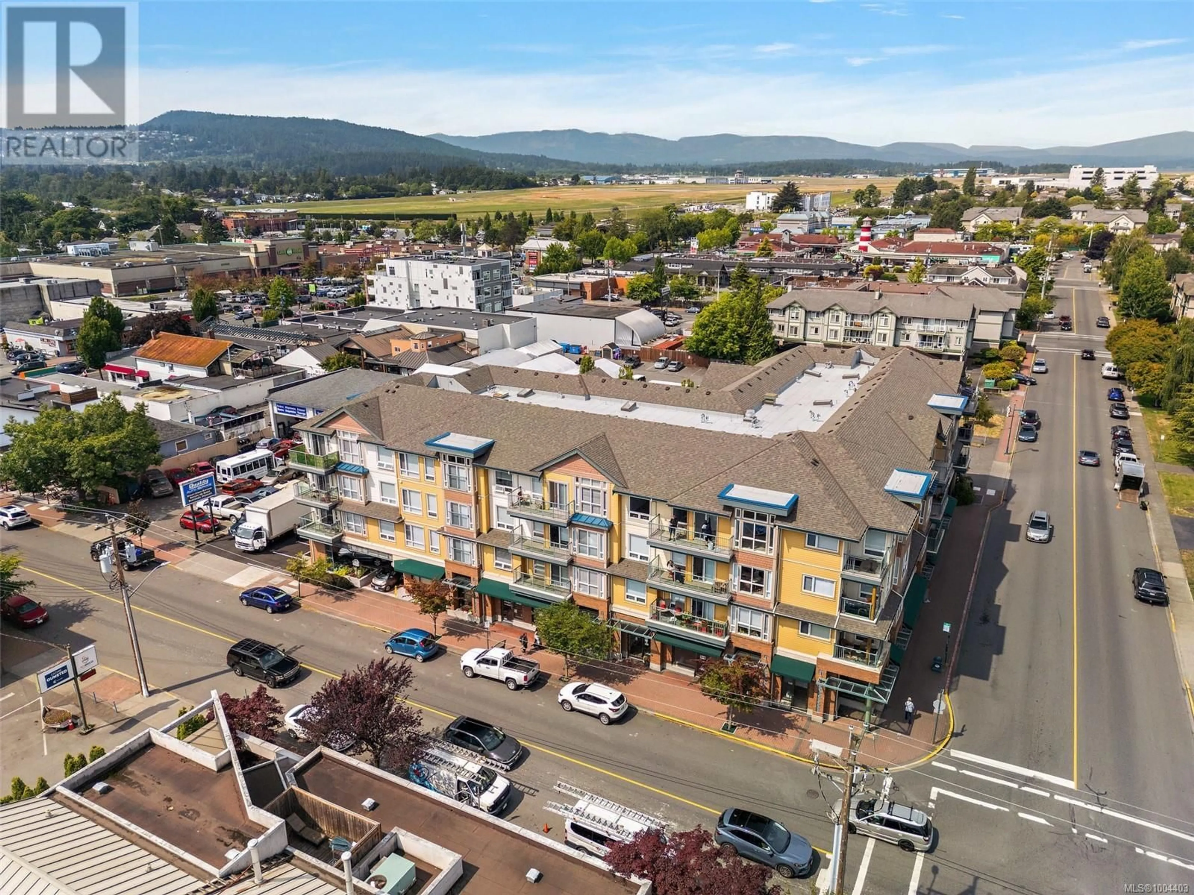A pic from outside/outdoor area/front of a property/back of a property/a pic from drone, mountain view for 211 - 9840 FIFTH STREET, Sidney British Columbia V8L2X3