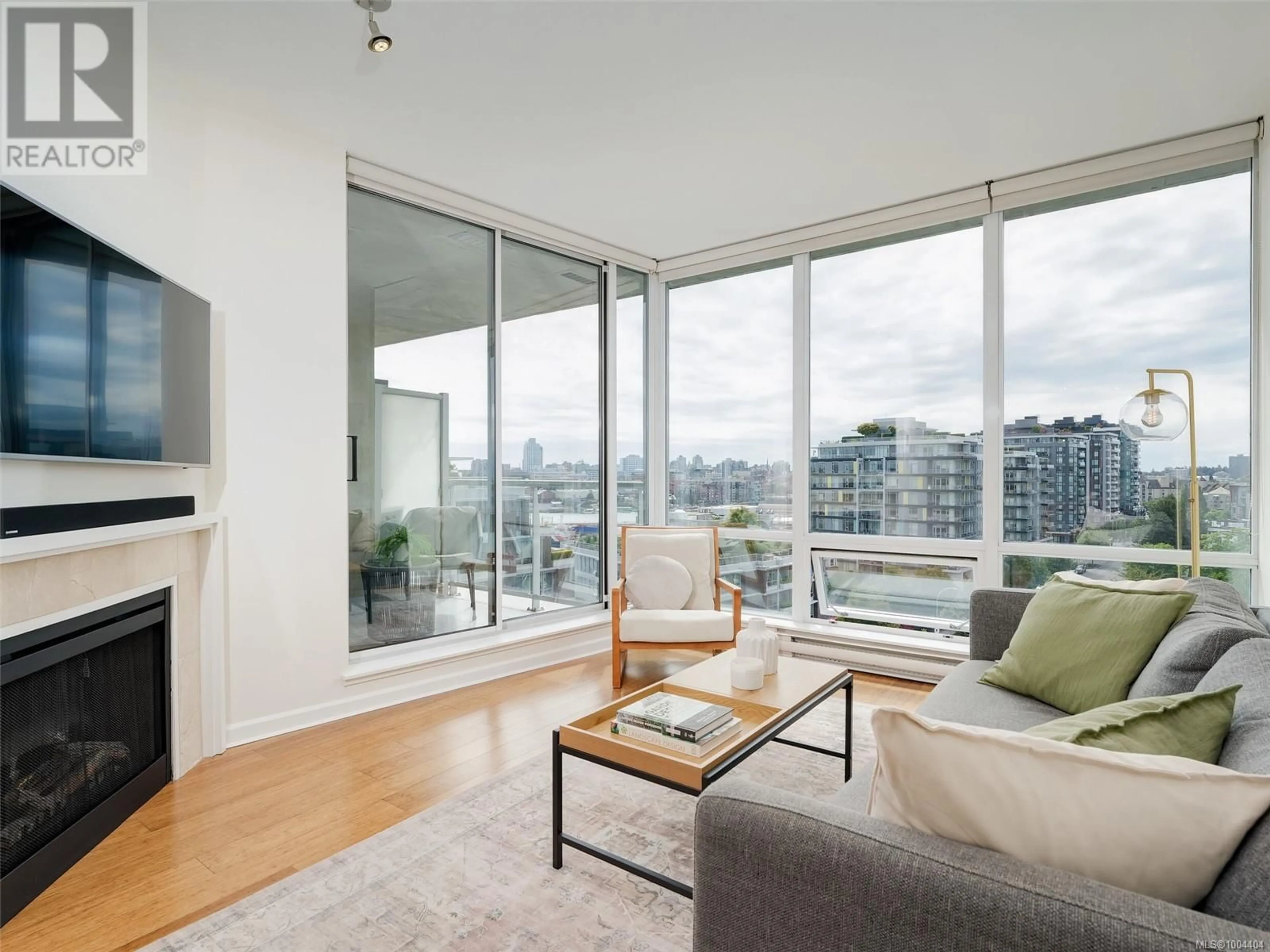 Living room with furniture, wood/laminate floor for 912 - 160 WILSON STREET, Victoria British Columbia V9A7P9