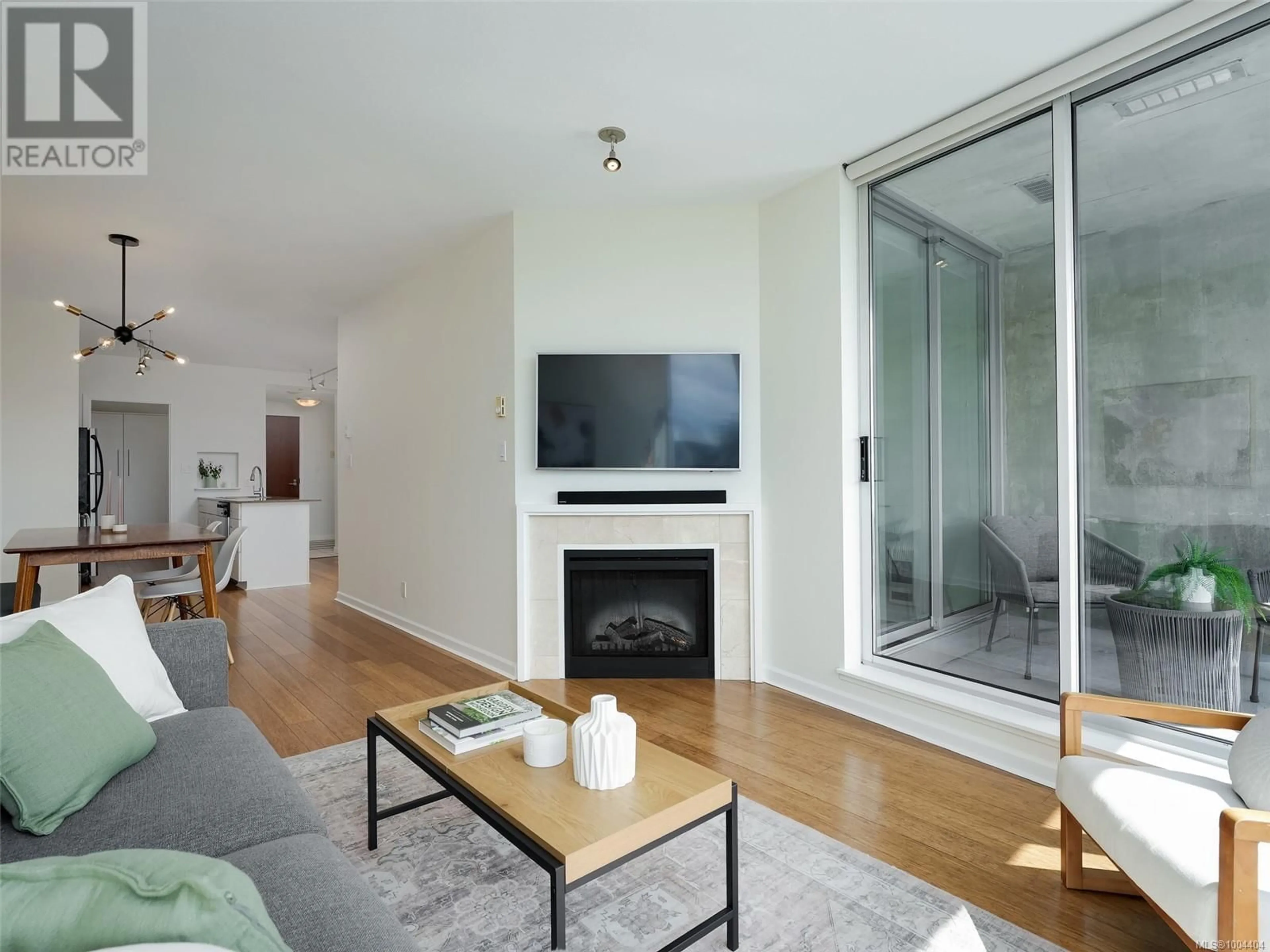 Living room with furniture, wood/laminate floor for 912 - 160 WILSON STREET, Victoria British Columbia V9A7P9
