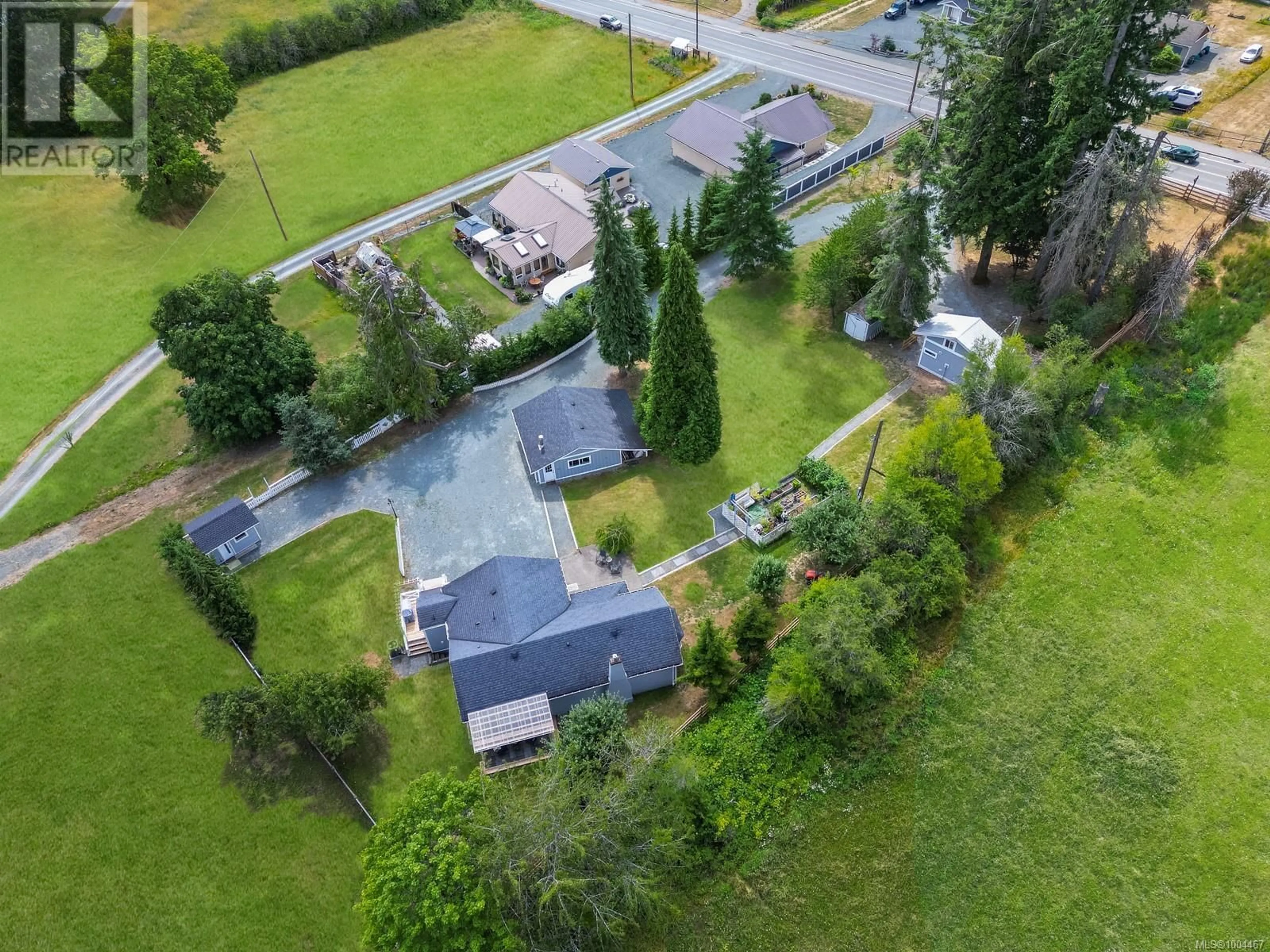 A pic from outside/outdoor area/front of a property/back of a property/a pic from drone, street for 3147 DRINKWATER ROAD, Duncan British Columbia V9L5Z1