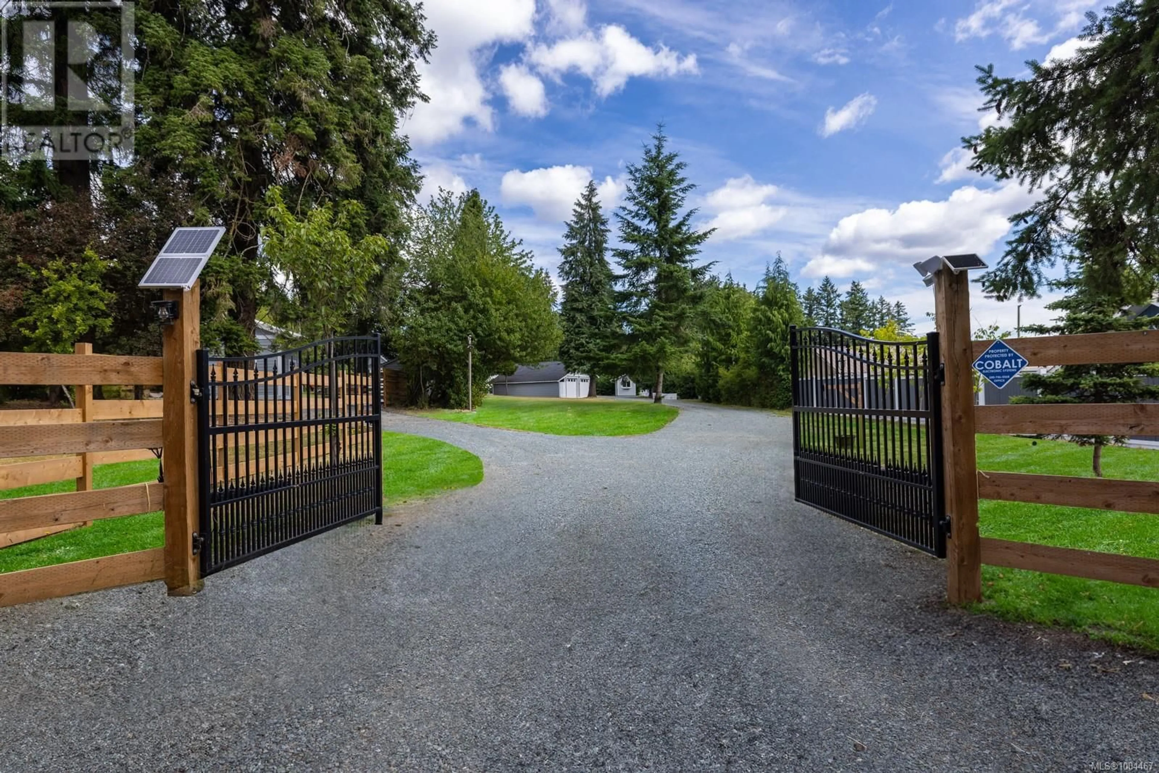 A pic from outside/outdoor area/front of a property/back of a property/a pic from drone, street for 3147 DRINKWATER ROAD, Duncan British Columbia V9L5Z1