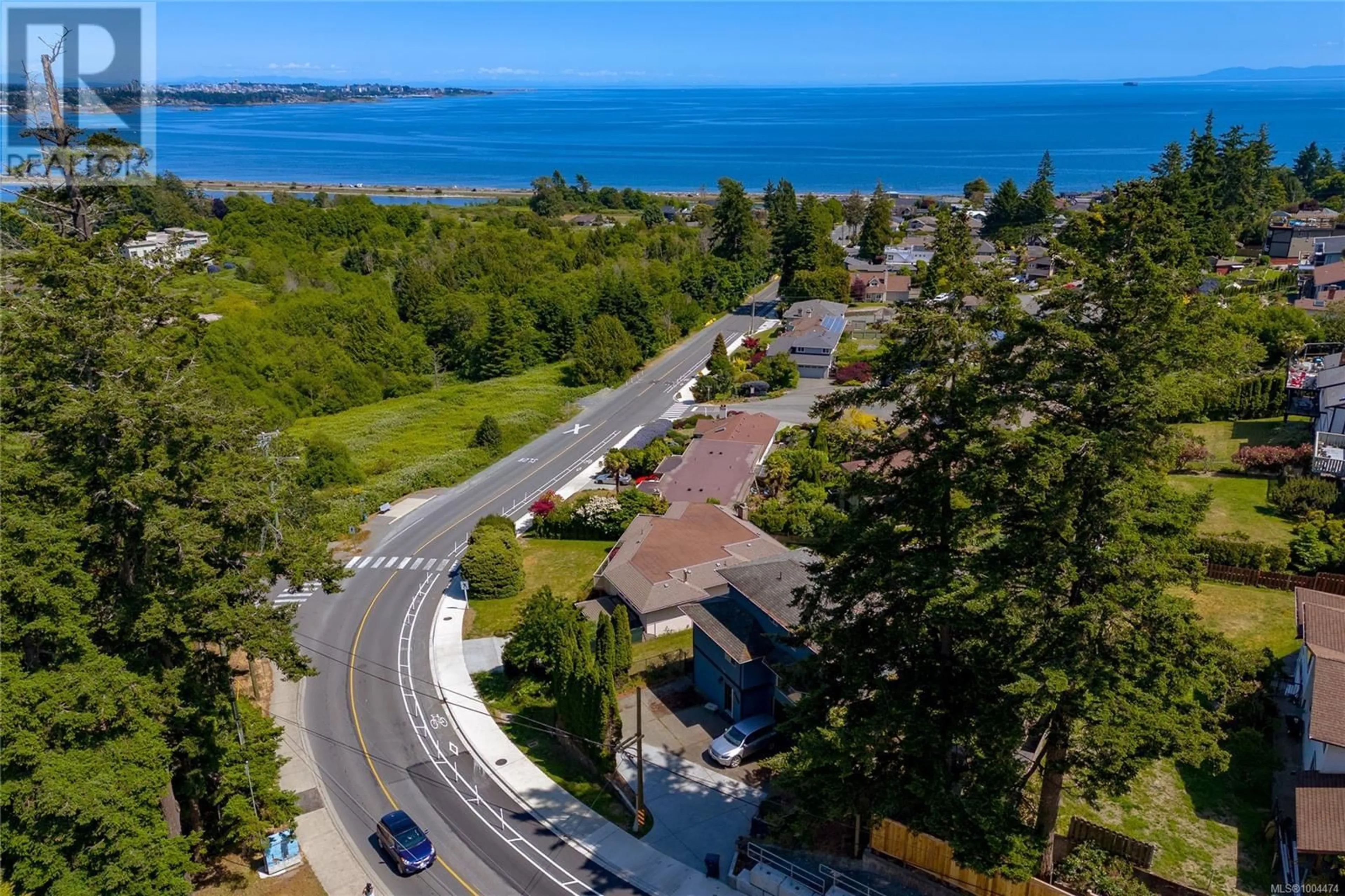 A pic from outside/outdoor area/front of a property/back of a property/a pic from drone, water/lake/river/ocean view for 303 LAGOON ROAD, Colwood British Columbia V9C3T3