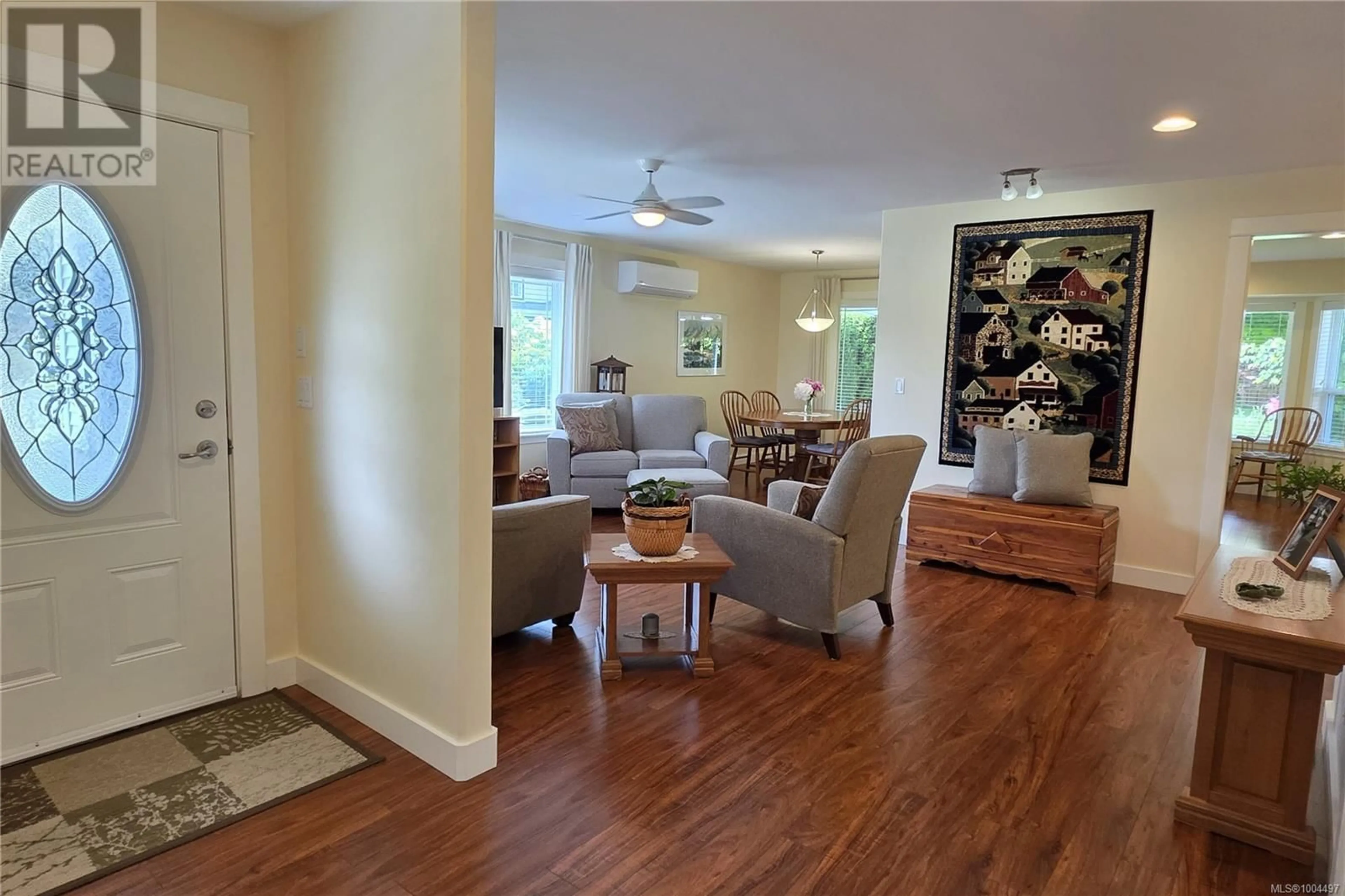 Living room with furniture, wood/laminate floor for 3696 JASPER AVENUE, Campbell River British Columbia V9H0A2