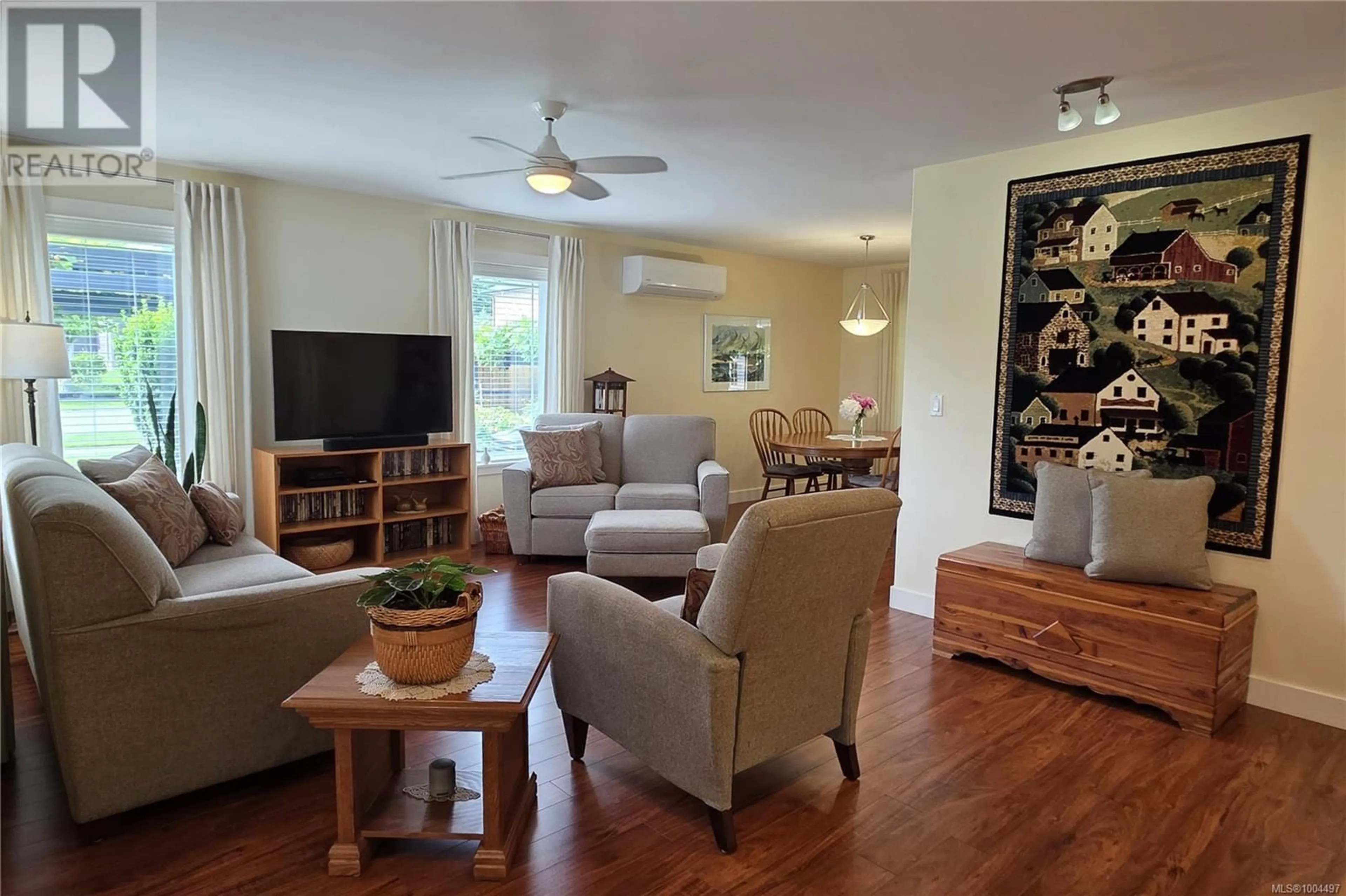 Living room with furniture, wood/laminate floor for 3696 JASPER AVENUE, Campbell River British Columbia V9H0A2