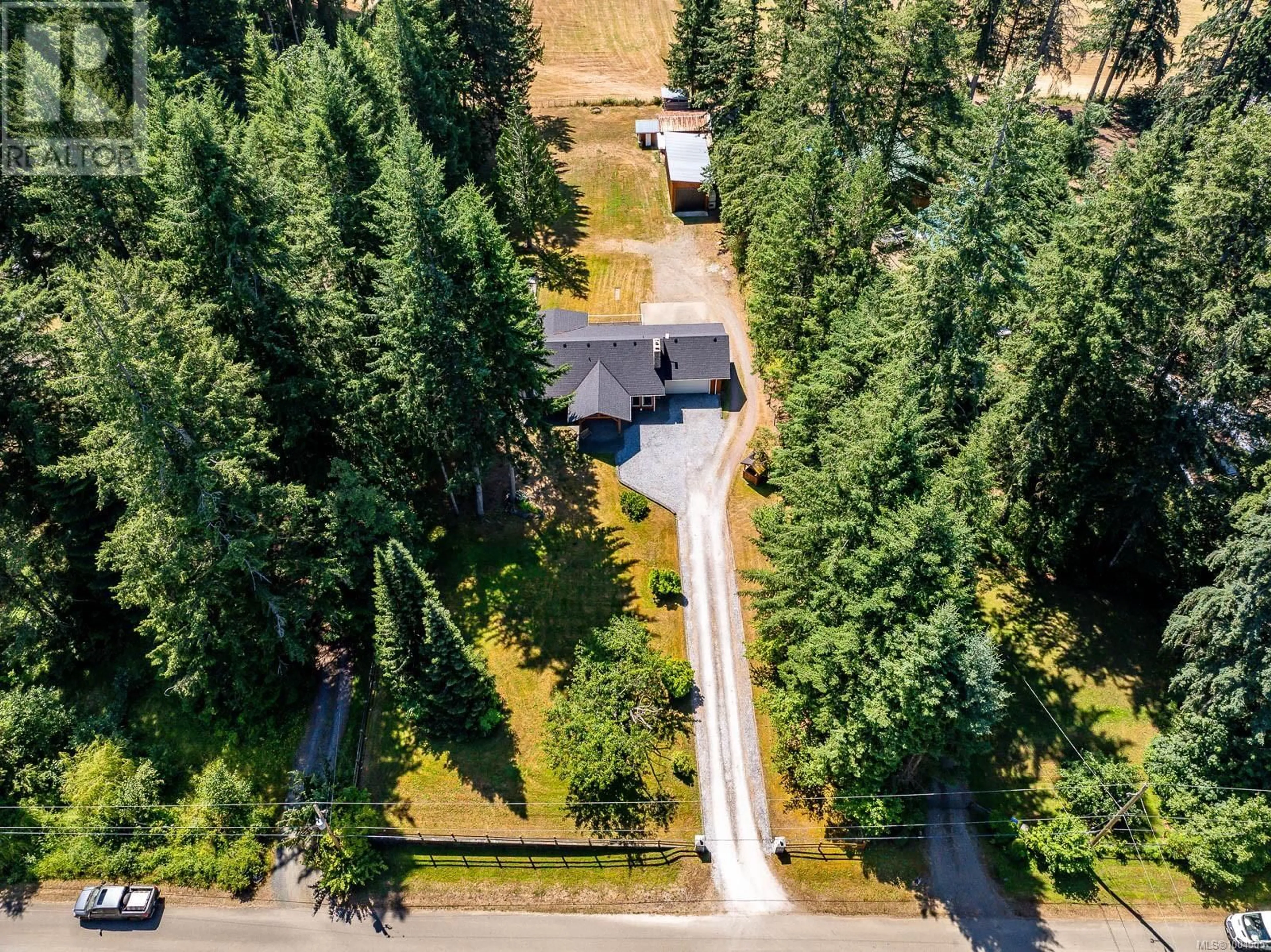 A pic from outside/outdoor area/front of a property/back of a property/a pic from drone, forest/trees view for 2001 DZINI ROAD, Black Creek British Columbia V9J1H1