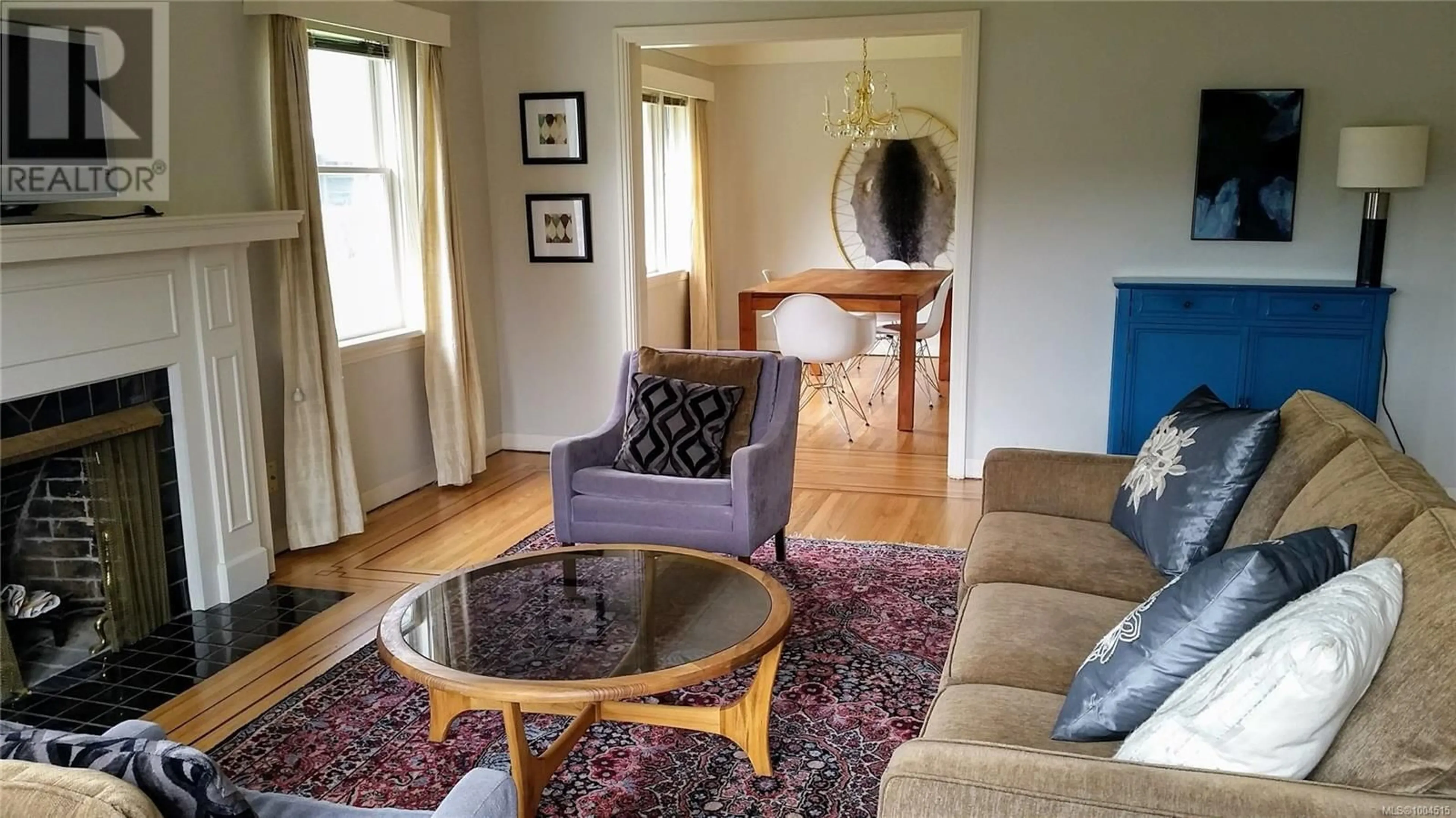 Living room with furniture, wood/laminate floor for 1174 SCHRAM DRIVE, Saanich British Columbia V8P2K2
