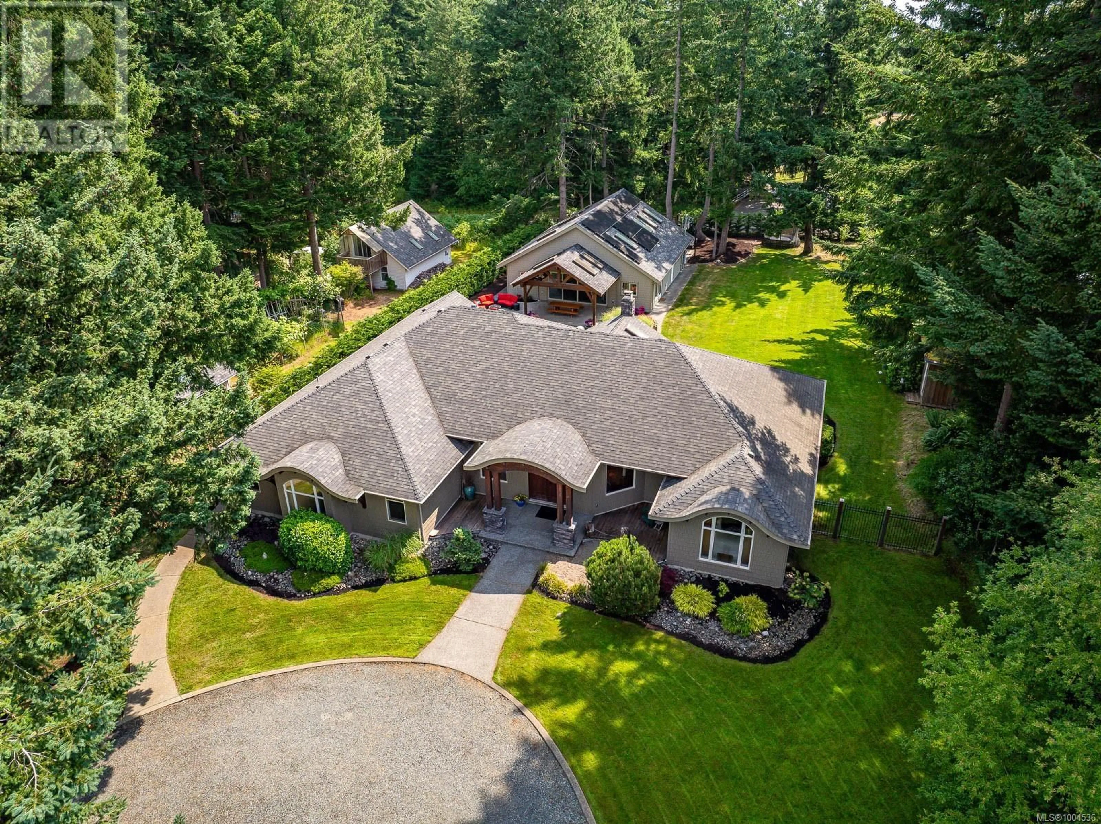 A pic from outside/outdoor area/front of a property/back of a property/a pic from drone, mountain view for 142 MULHOLLAND DRIVE, Comox British Columbia V9M3W5