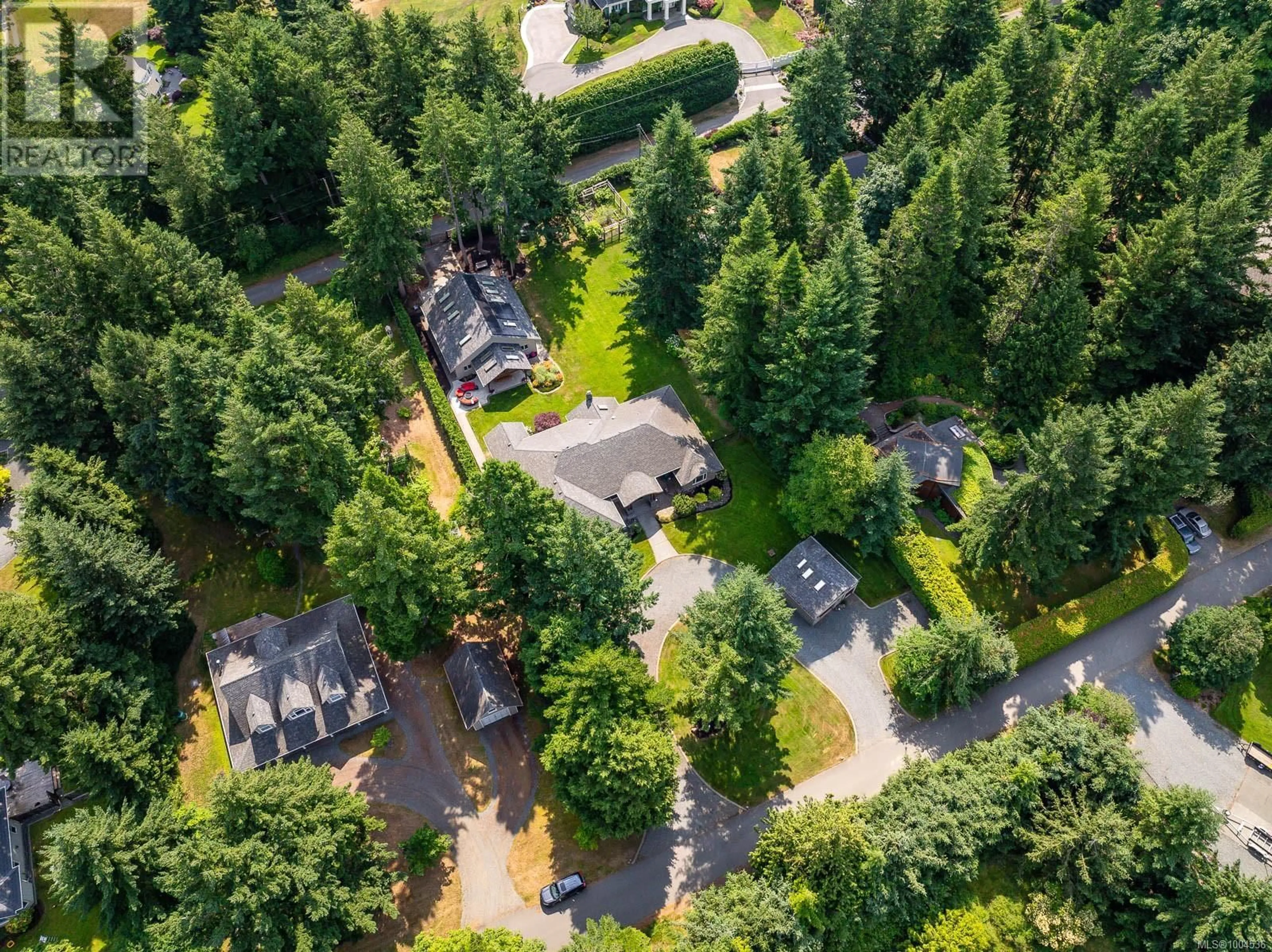 A pic from outside/outdoor area/front of a property/back of a property/a pic from drone, forest/trees view for 142 MULHOLLAND DRIVE, Comox British Columbia V9M3W5