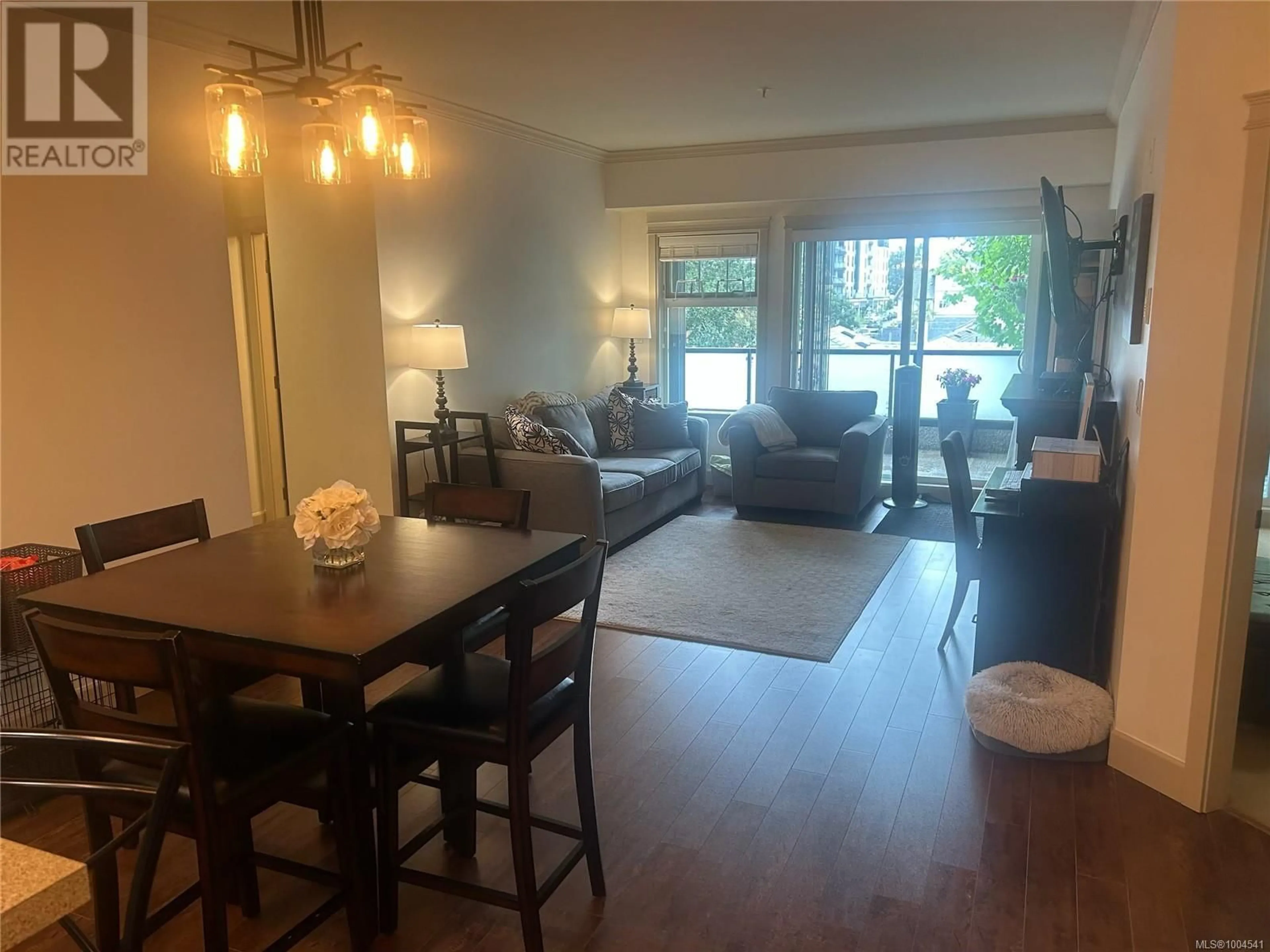Living room with furniture, wood/laminate floor for 203 - 2881 PEATT ROAD, Langford British Columbia V9B3V7
