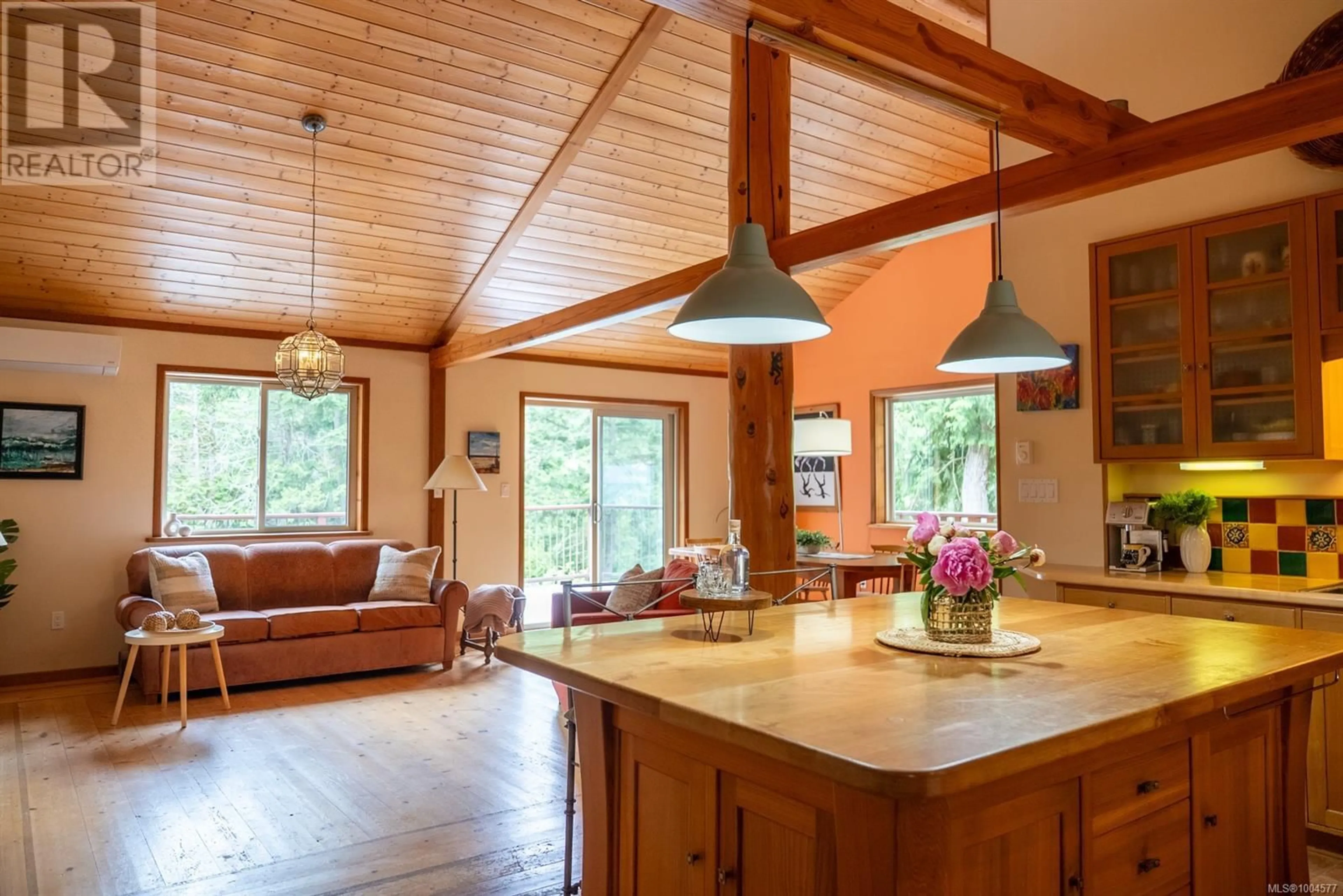 Open concept kitchen, wood/laminate floor for 5574 HOOSON ROAD, Pender Island British Columbia V0N2M1