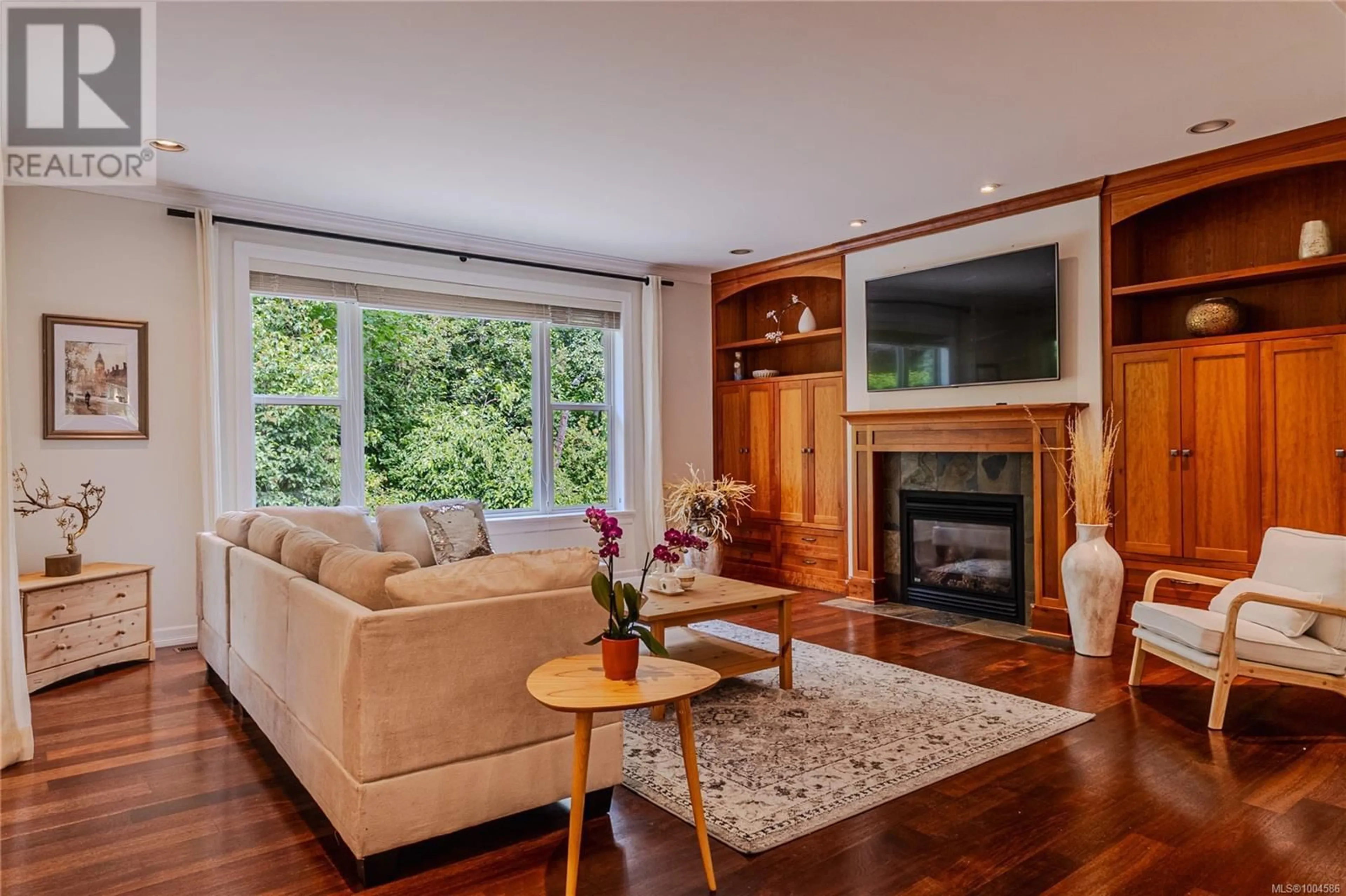 Living room with furniture, wood/laminate floor for 3948 TELEGRAPH BAY ROAD, Saanich British Columbia V8N4H7