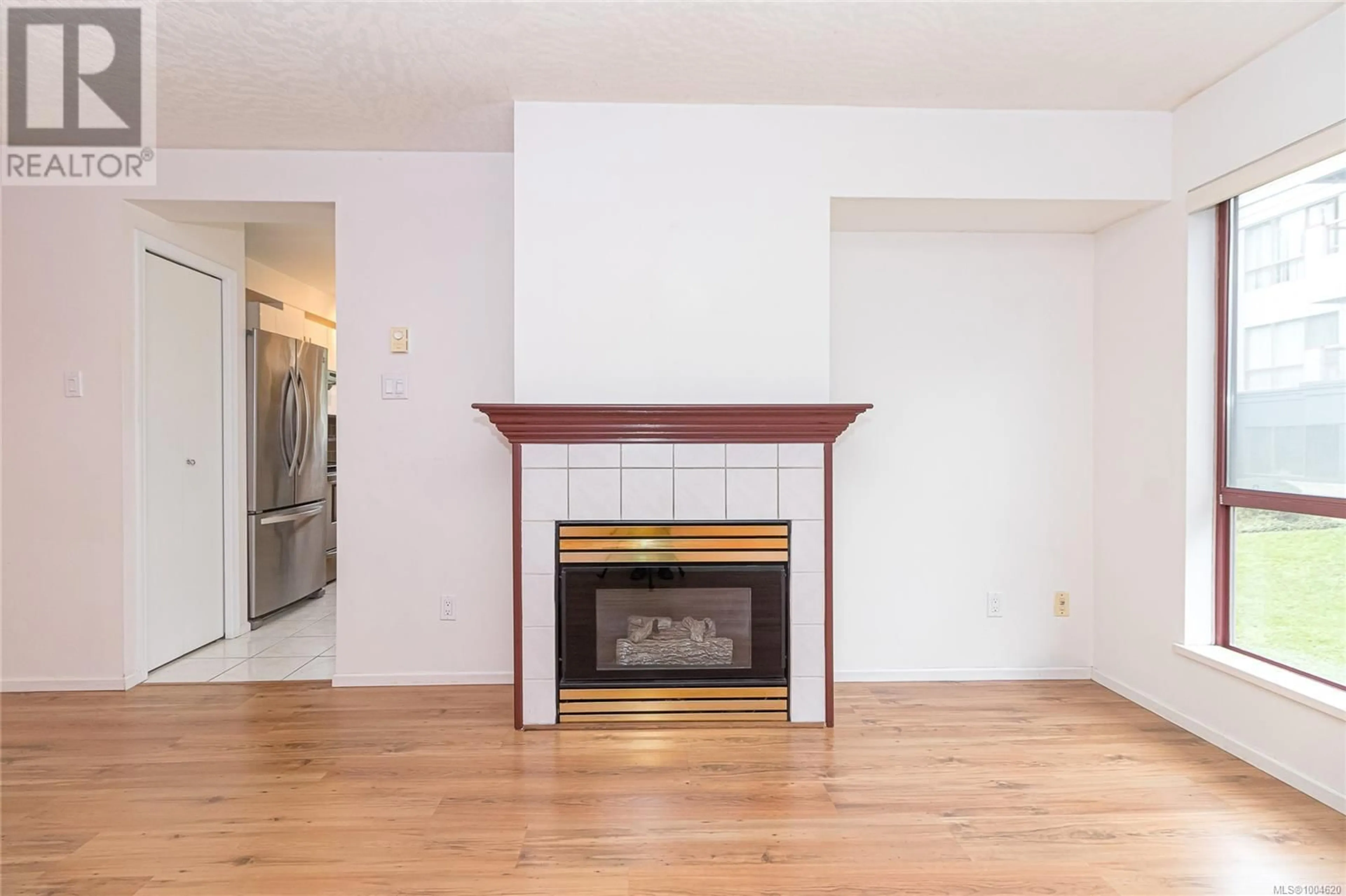 Living room with furniture, wood/laminate floor for 201 - 520 DUNEDIN STREET, Victoria British Columbia V8T2L6