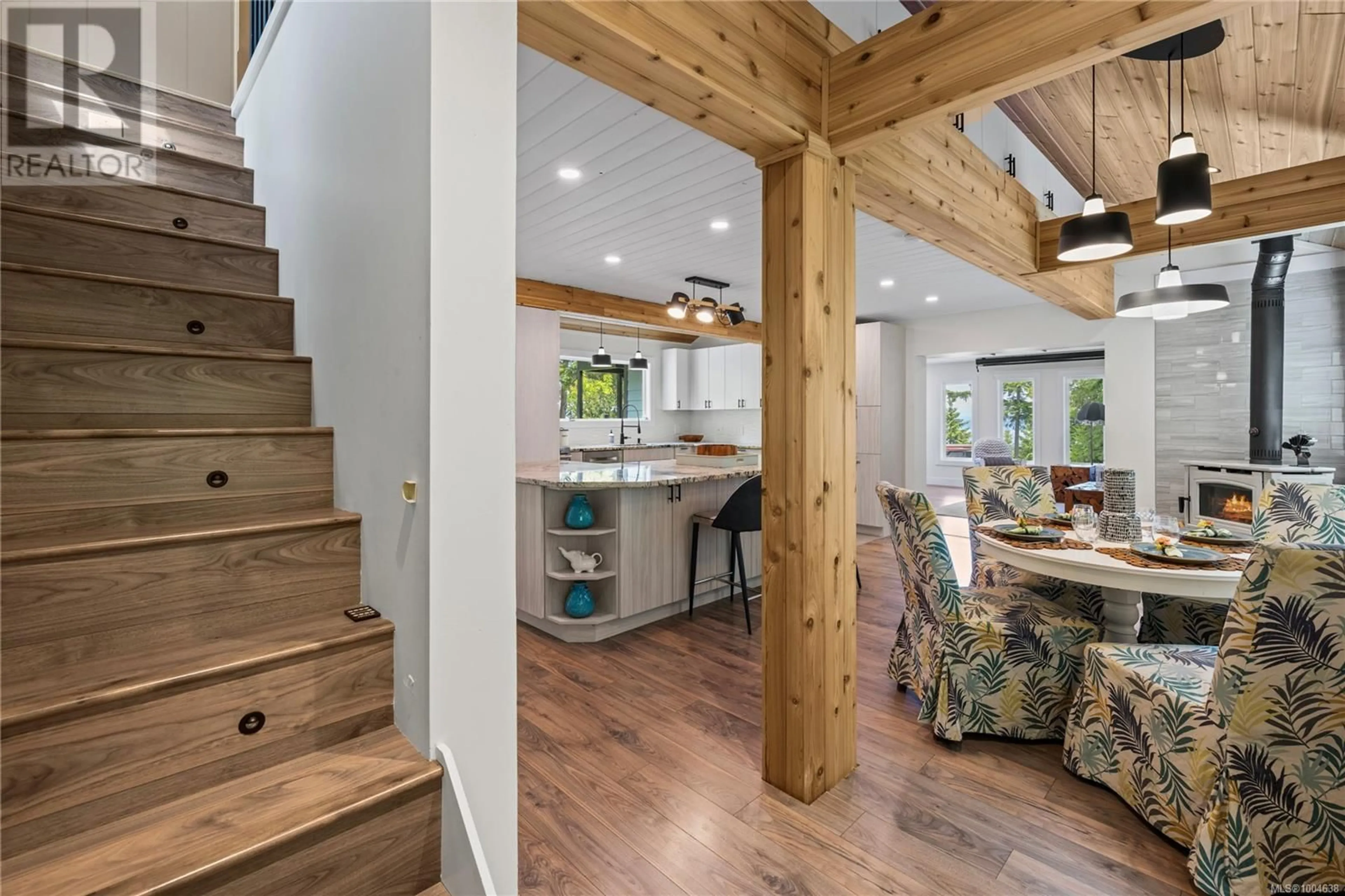 Open concept kitchen, wood/laminate floor for 1870 WALLACE WOOD WAY, Qualicum Beach British Columbia V9K2L6