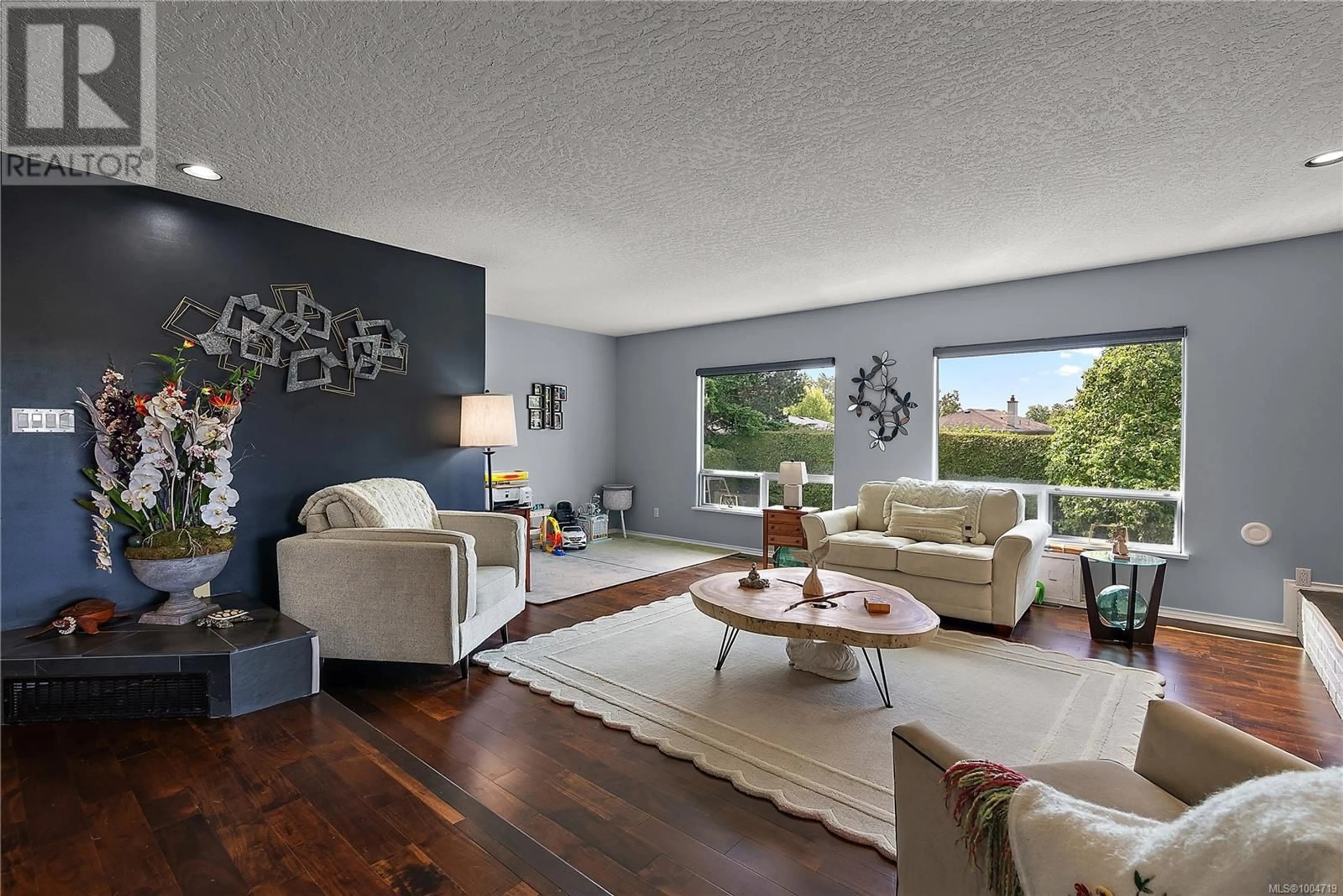 Living room with furniture, unknown for 1529 MT. DOUGLAS CROSS ROAD, Saanich British Columbia V8N1Z9
