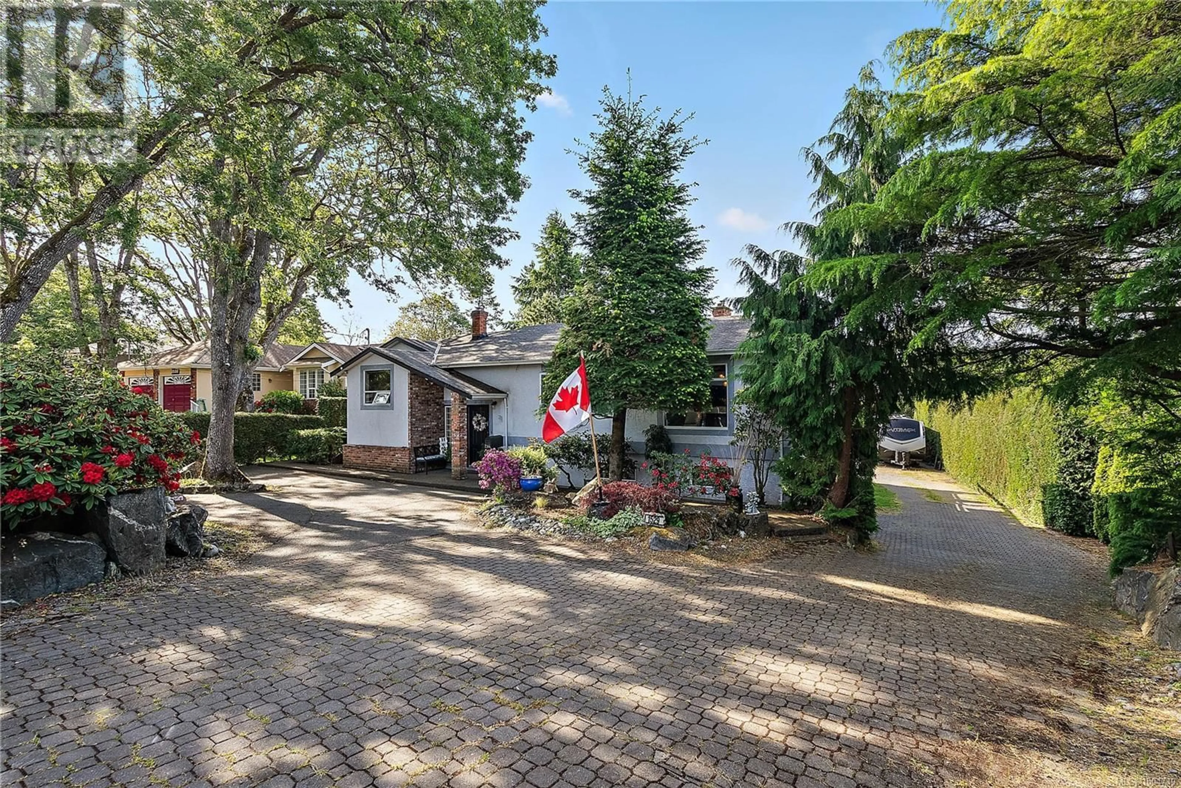 A pic from outside/outdoor area/front of a property/back of a property/a pic from drone, street for 1529 MT. DOUGLAS CROSS ROAD, Saanich British Columbia V8N1Z9
