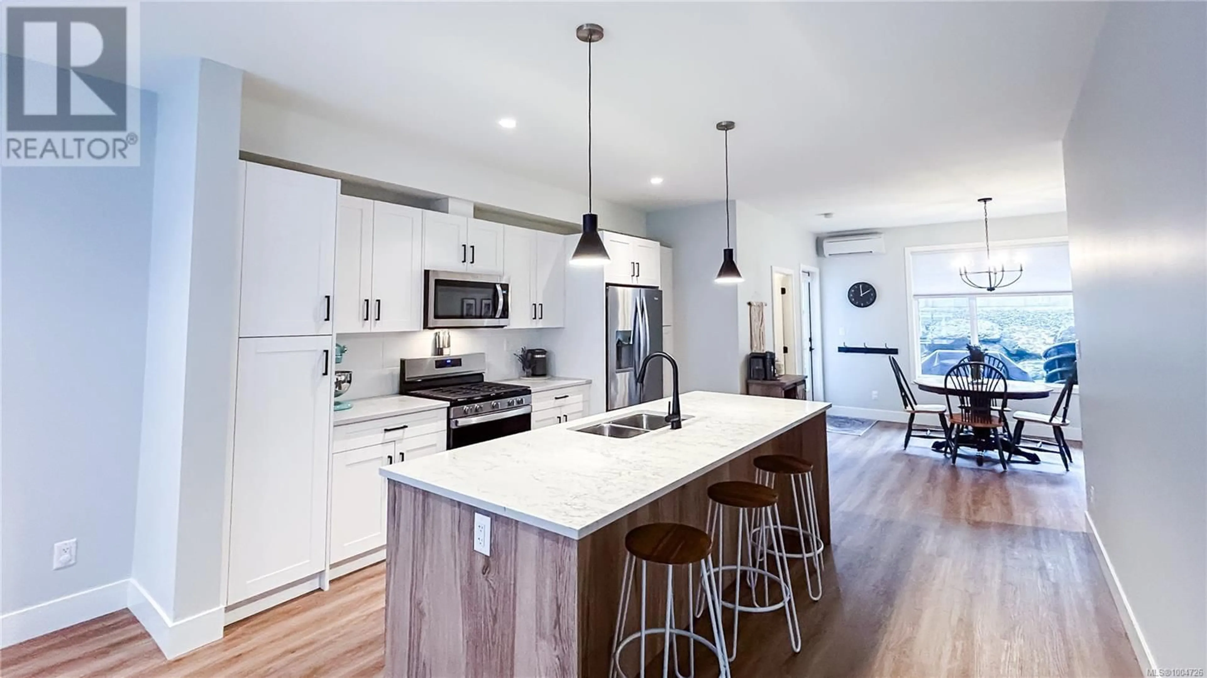 Open concept kitchen, wood/laminate floor for 107 - 2130 TRIANGLE TRAIL, Langford British Columbia V9C0R2