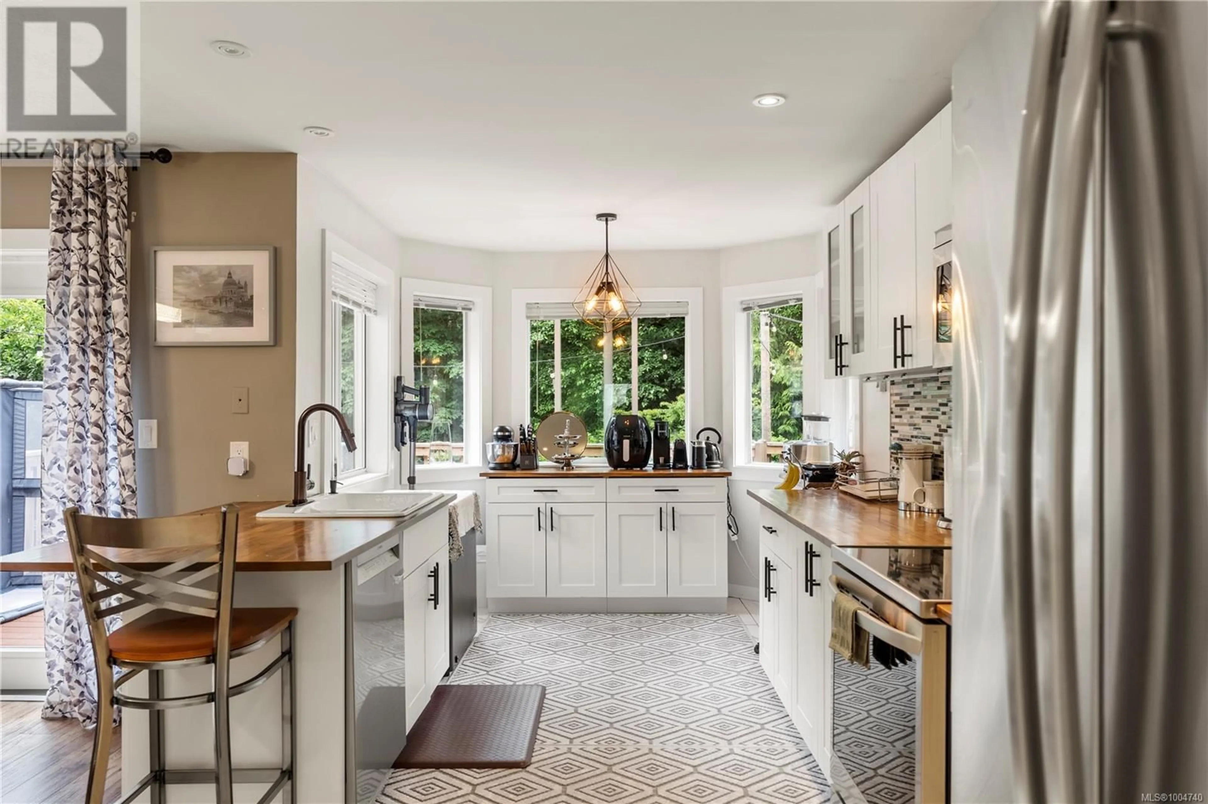 Open concept kitchen, ceramic/tile floor for 5839 BLYTHWOOD ROAD, Sooke British Columbia V9Z0G3