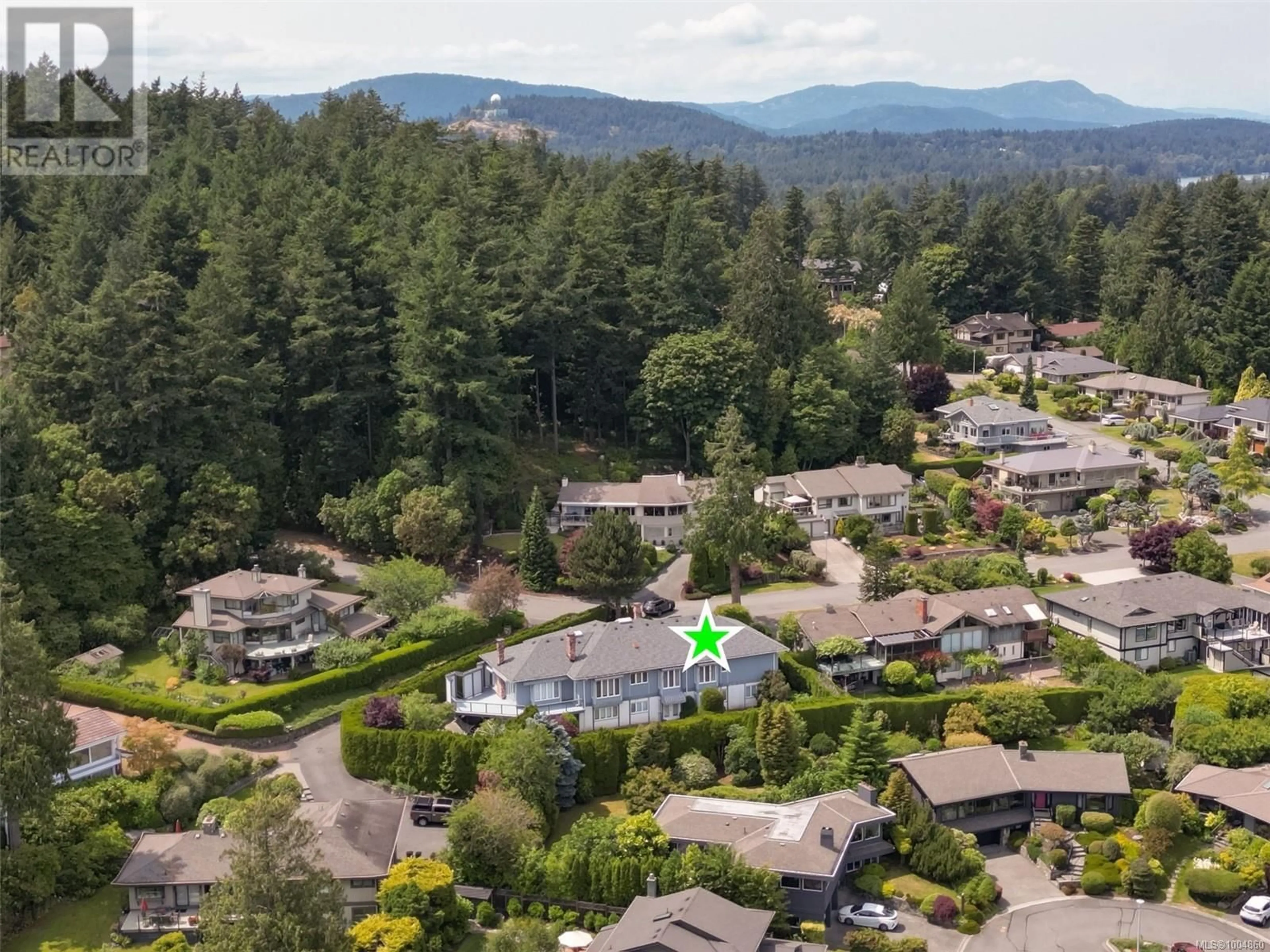 A pic from outside/outdoor area/front of a property/back of a property/a pic from drone, mountain view for 4821 AMBLEWOOD DRIVE, Saanich British Columbia V8Y2S5