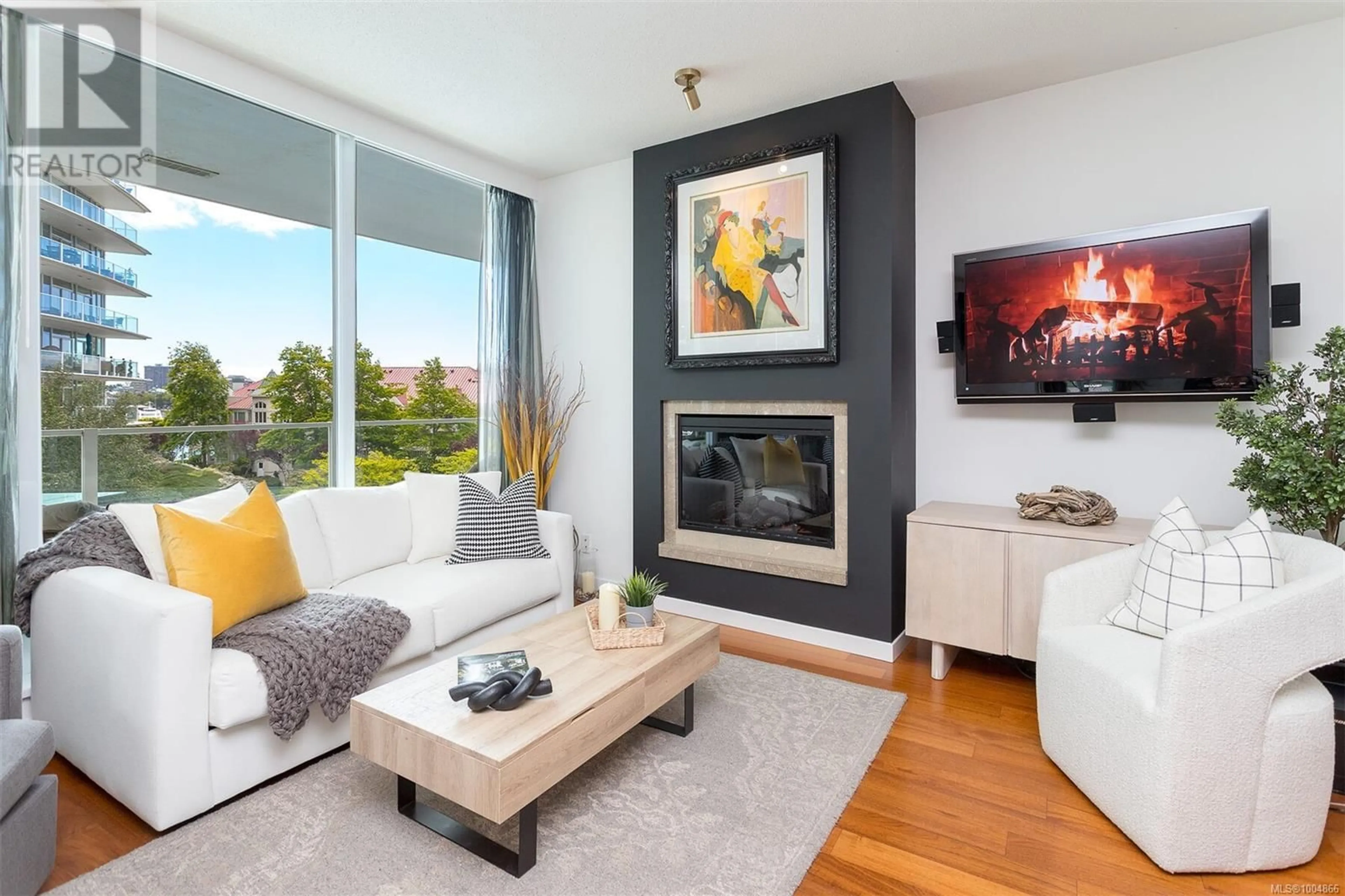 Living room with furniture, wood/laminate floor for 216 - 68 SONGHEES ROAD, Victoria British Columbia V9A0A3