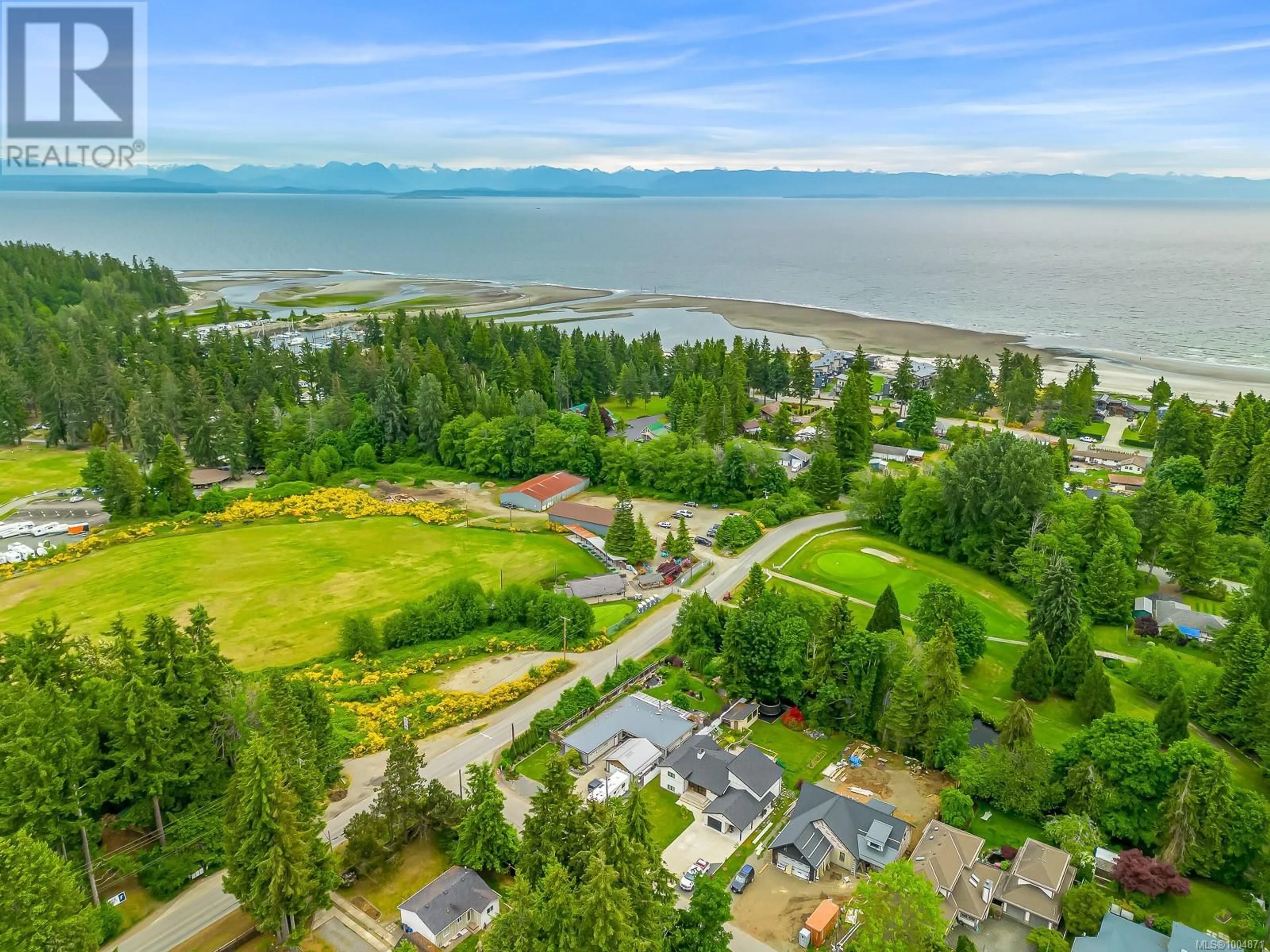 A pic from outside/outdoor area/front of a property/back of a property/a pic from drone, water/lake/river/ocean view for 8998 MCLAREY AVENUE, Black Creek British Columbia V9J1A2