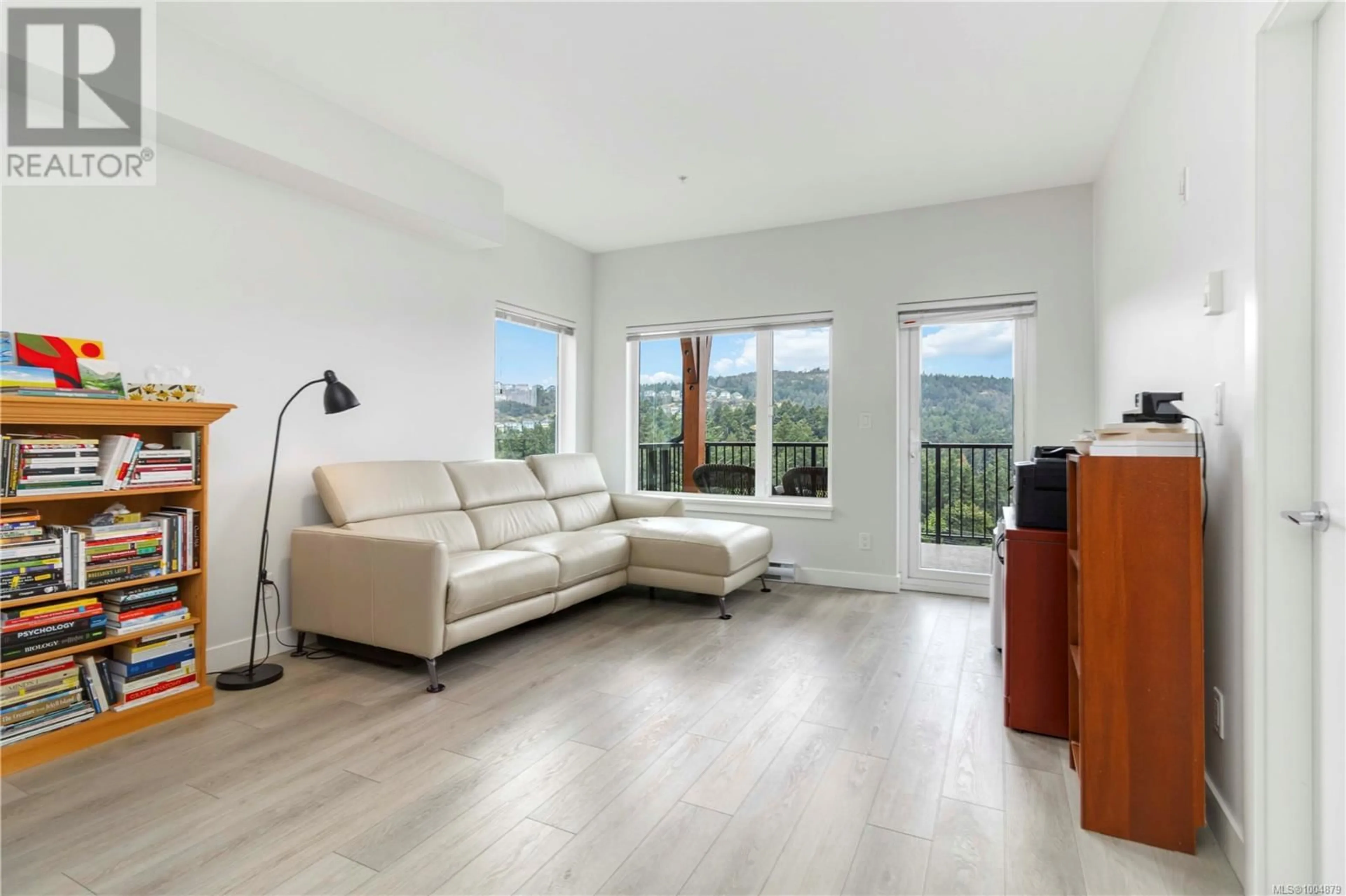 Living room with furniture, wood/laminate floor for 404 - 286 WILFERT ROAD, View Royal British Columbia V9C0H6