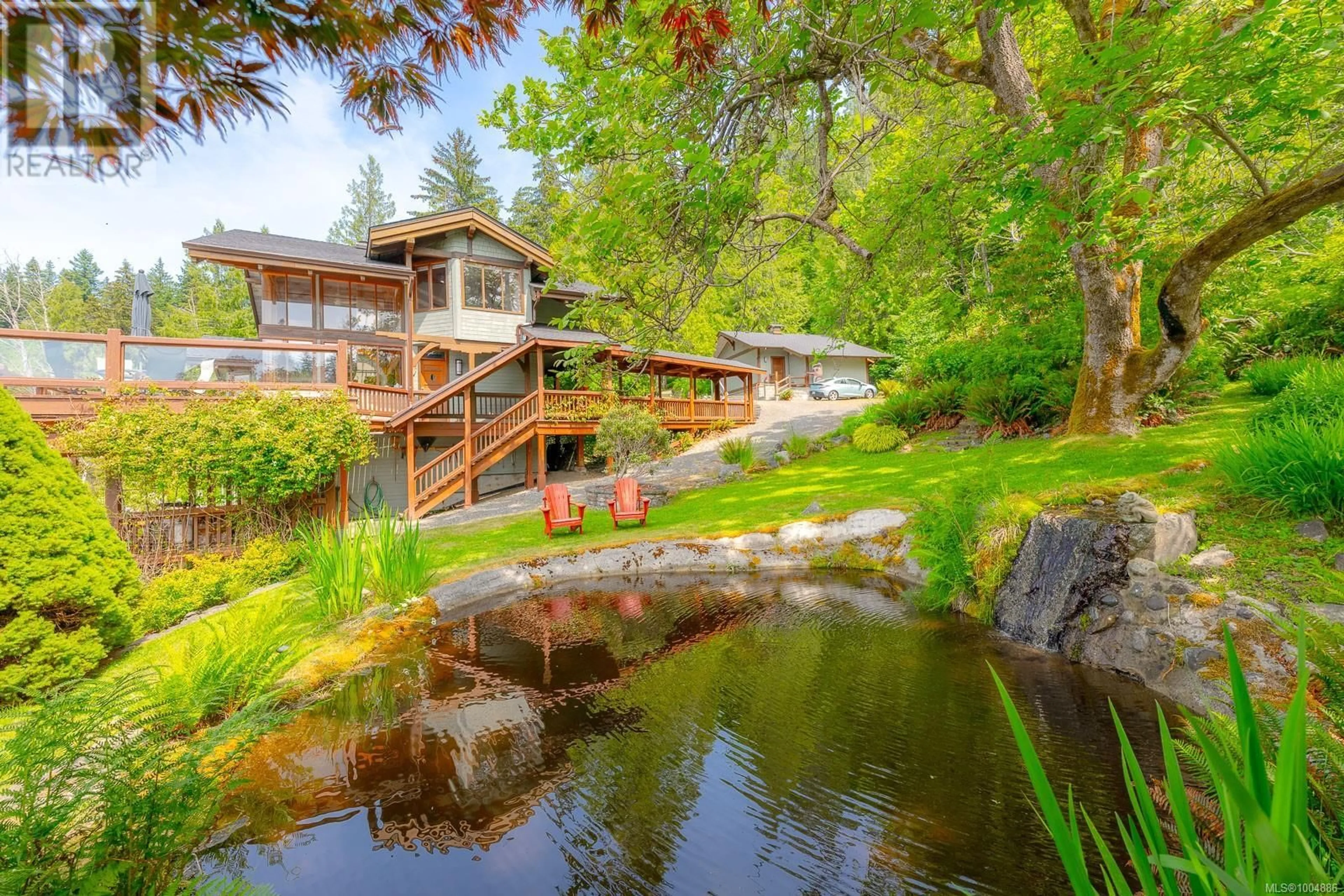 A pic from outside/outdoor area/front of a property/back of a property/a pic from drone, water/lake/river/ocean view for 1027&1033 WEST ROAD, Quadra Island British Columbia V0P1N0