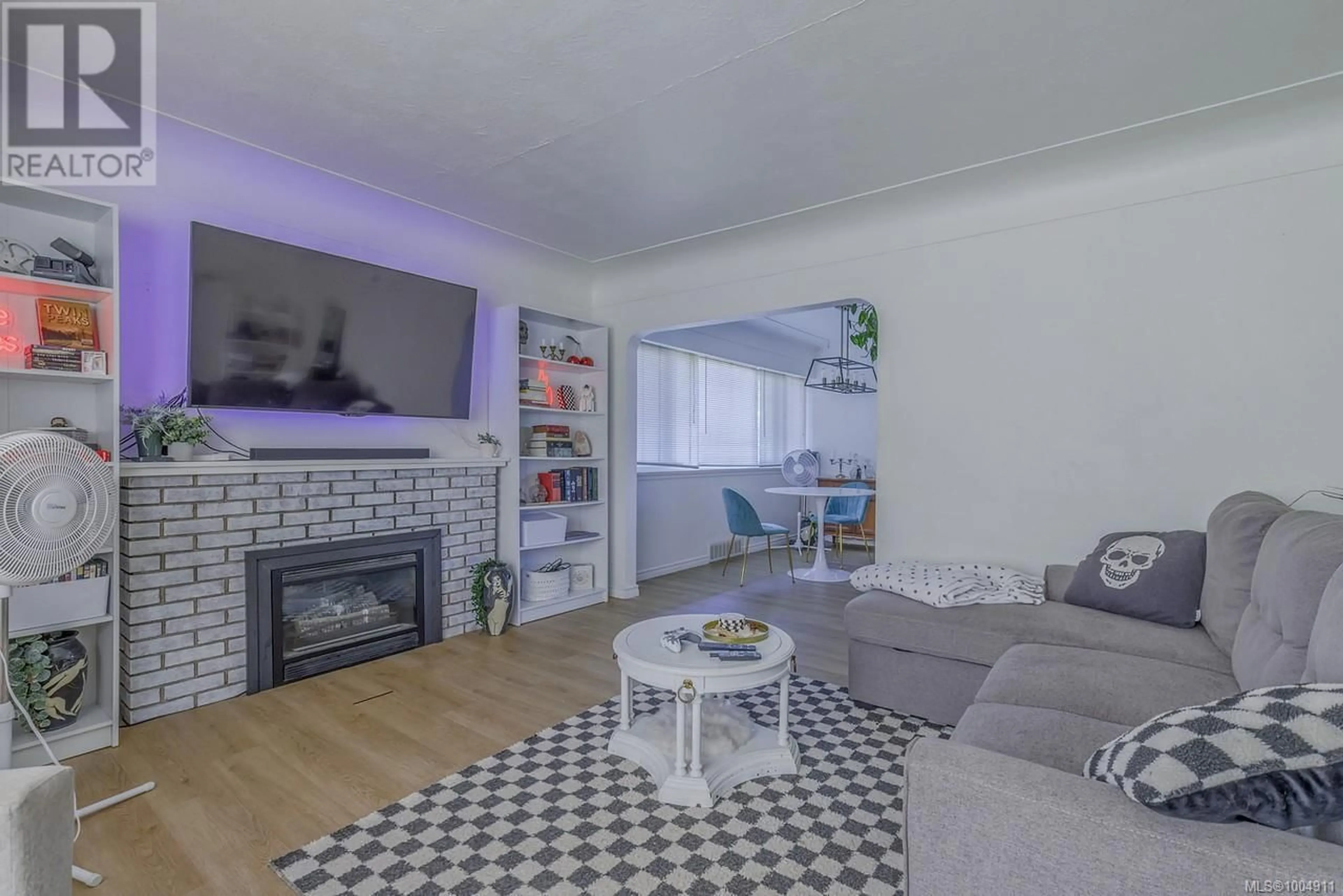 Living room with furniture, wood/laminate floor for 1212 WADDINGTON ROAD, Nanaimo British Columbia V9S4V5