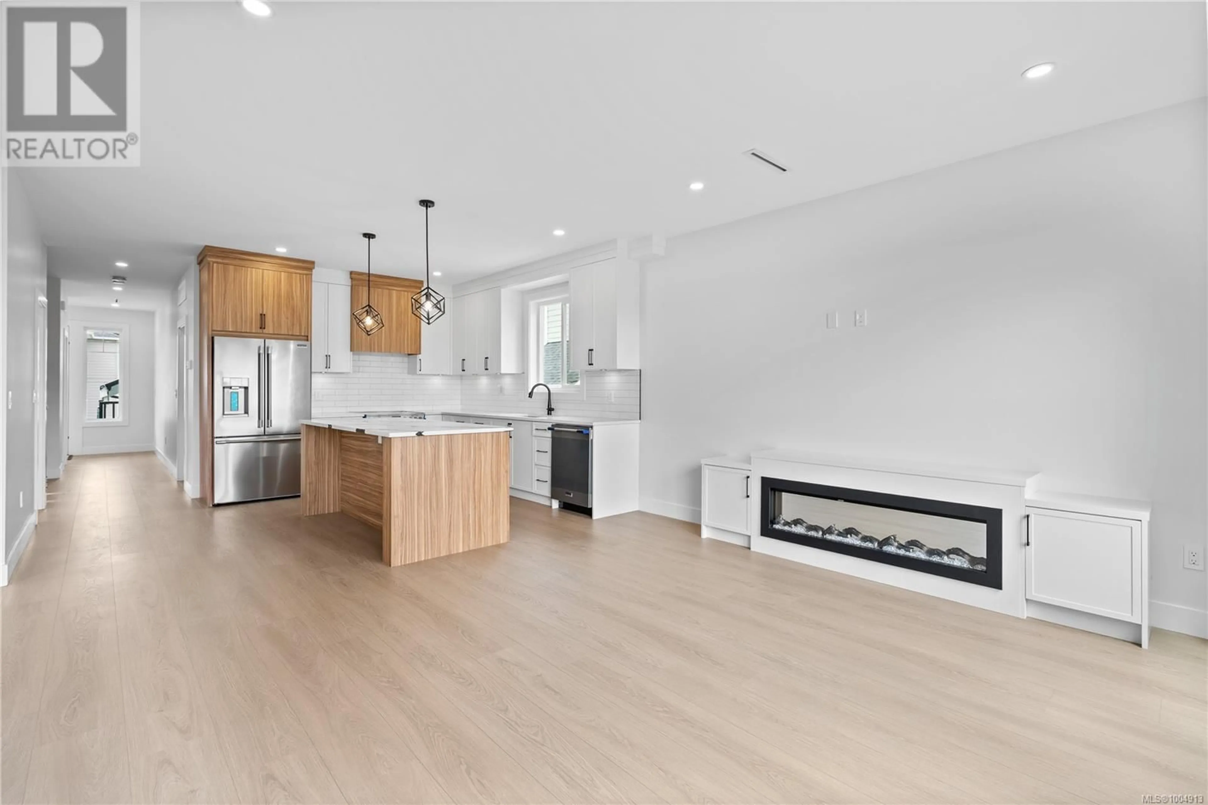 Open concept kitchen, wood/laminate floor for 2351 SWALLOW PLACE, Langford British Columbia V9B6Y6
