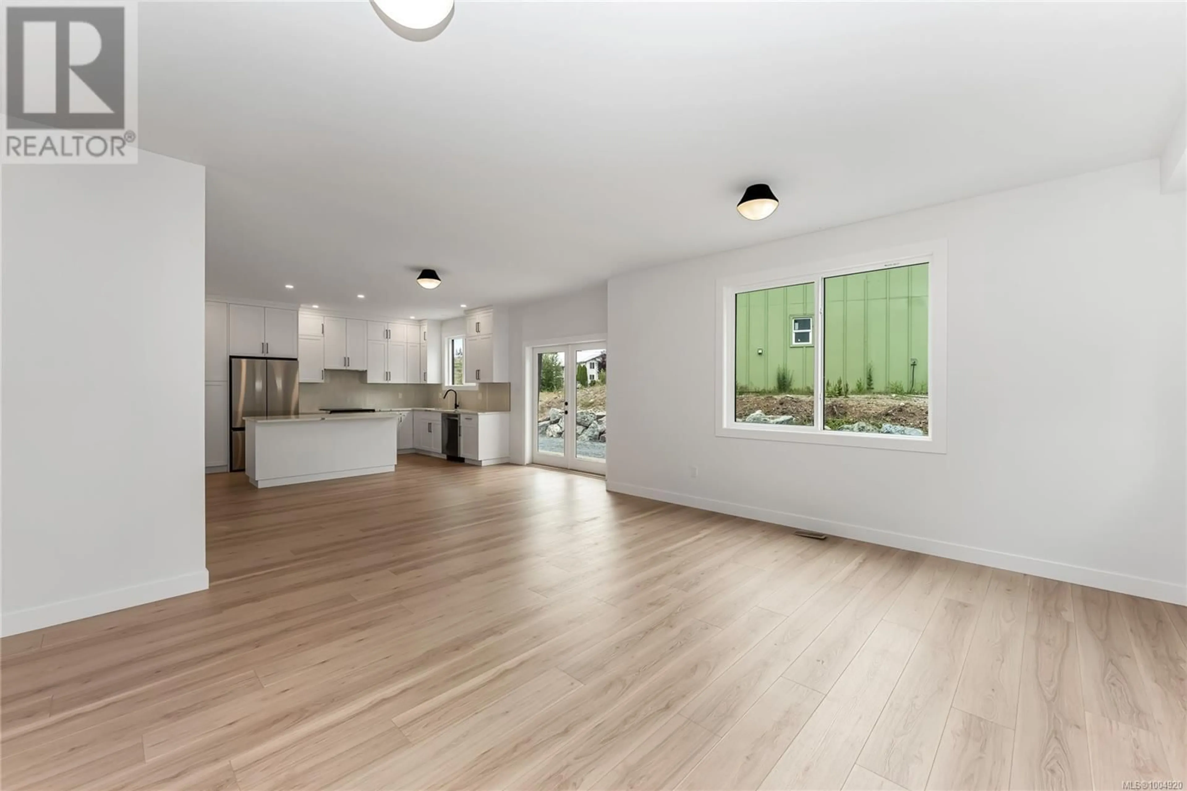 Open concept kitchen, wood/laminate floor for 129 COWICHAN LAKE ROAD, Lake Cowichan British Columbia V0R2G0