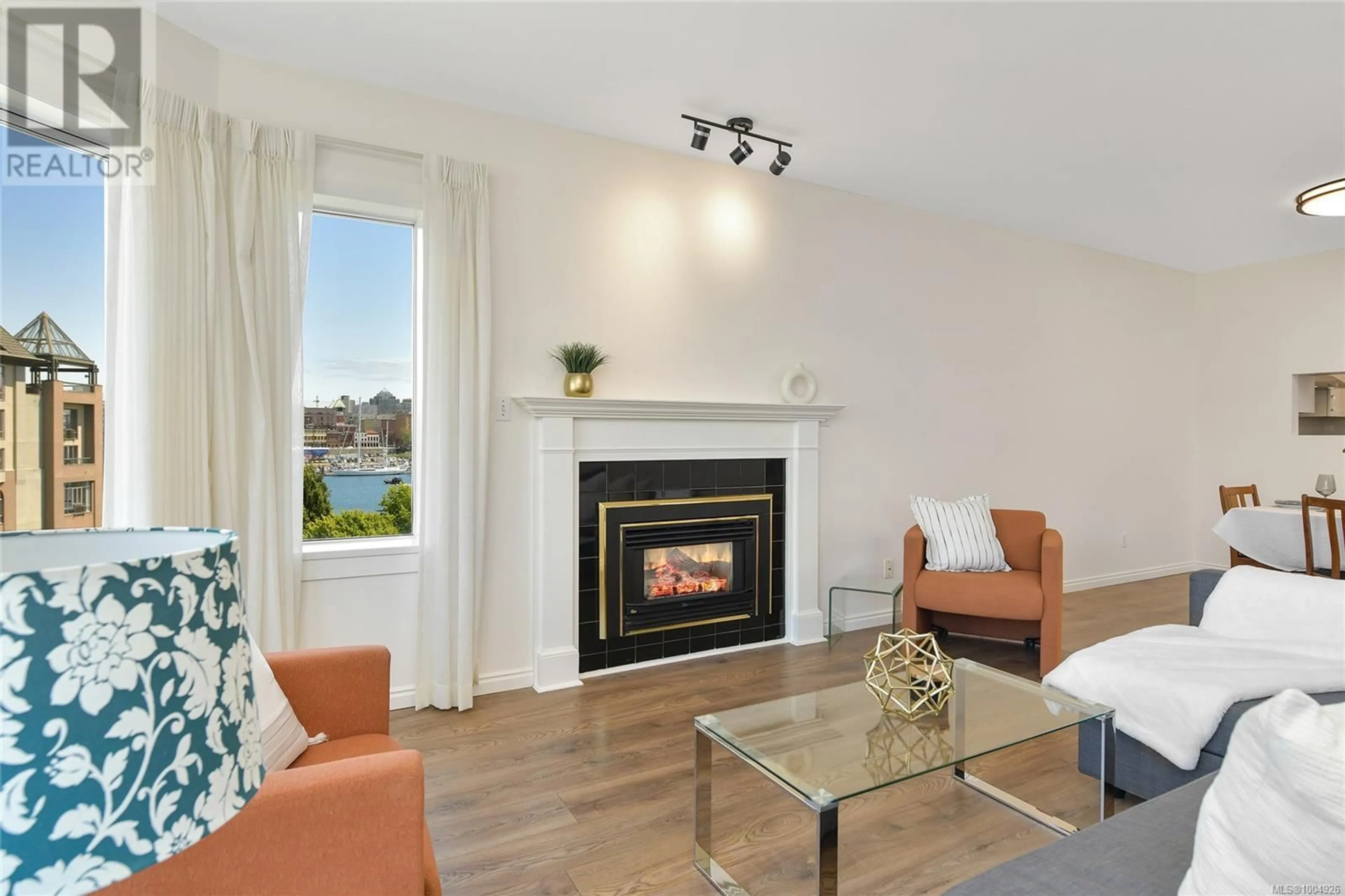 Living room with furniture, wood/laminate floor for 408 - 50 SONGHEES ROAD, Victoria British Columbia V9A7J4