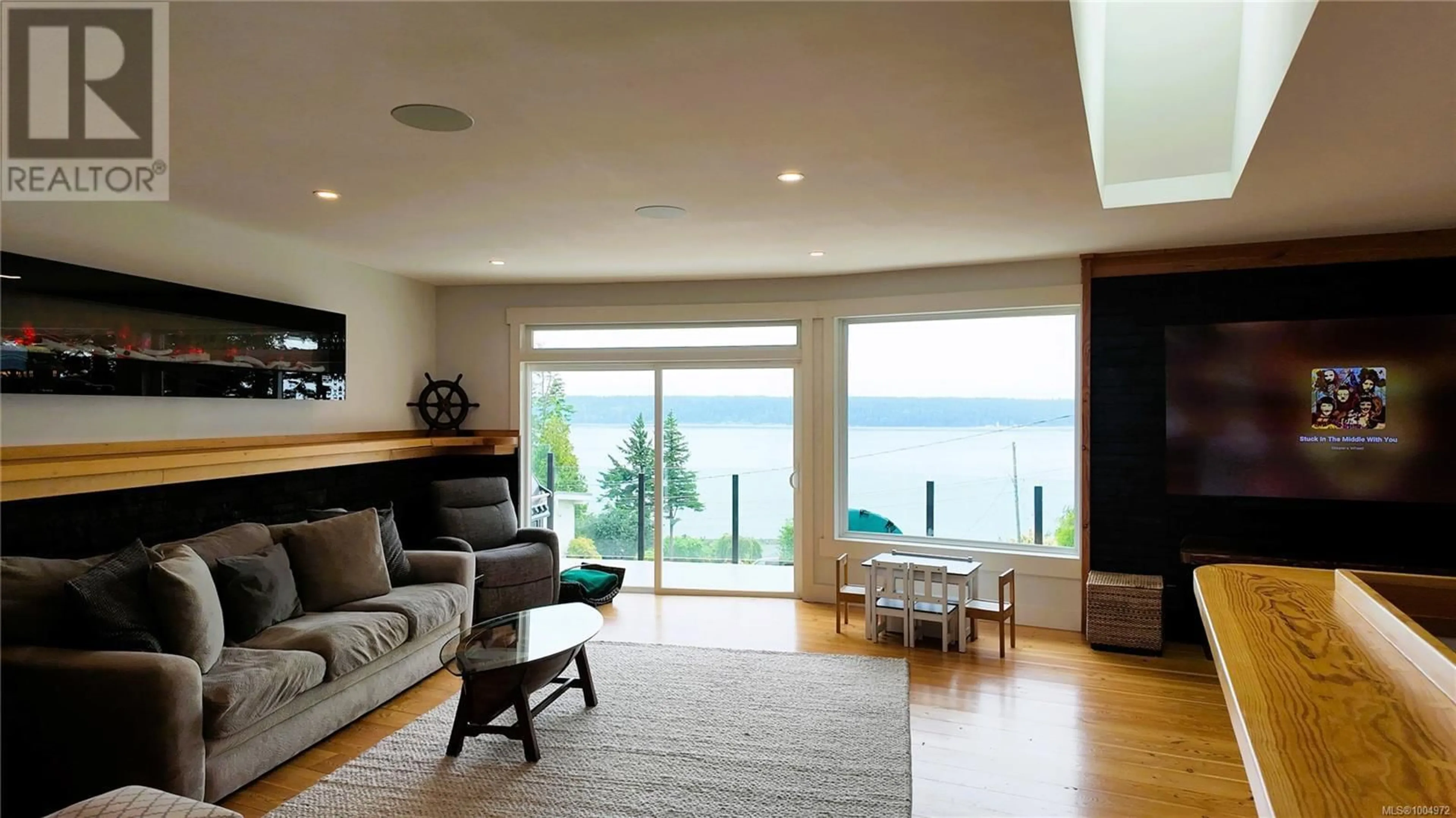 Living room with furniture, wood/laminate floor for 699 GALERNO ROAD, Campbell River British Columbia V9W5X4