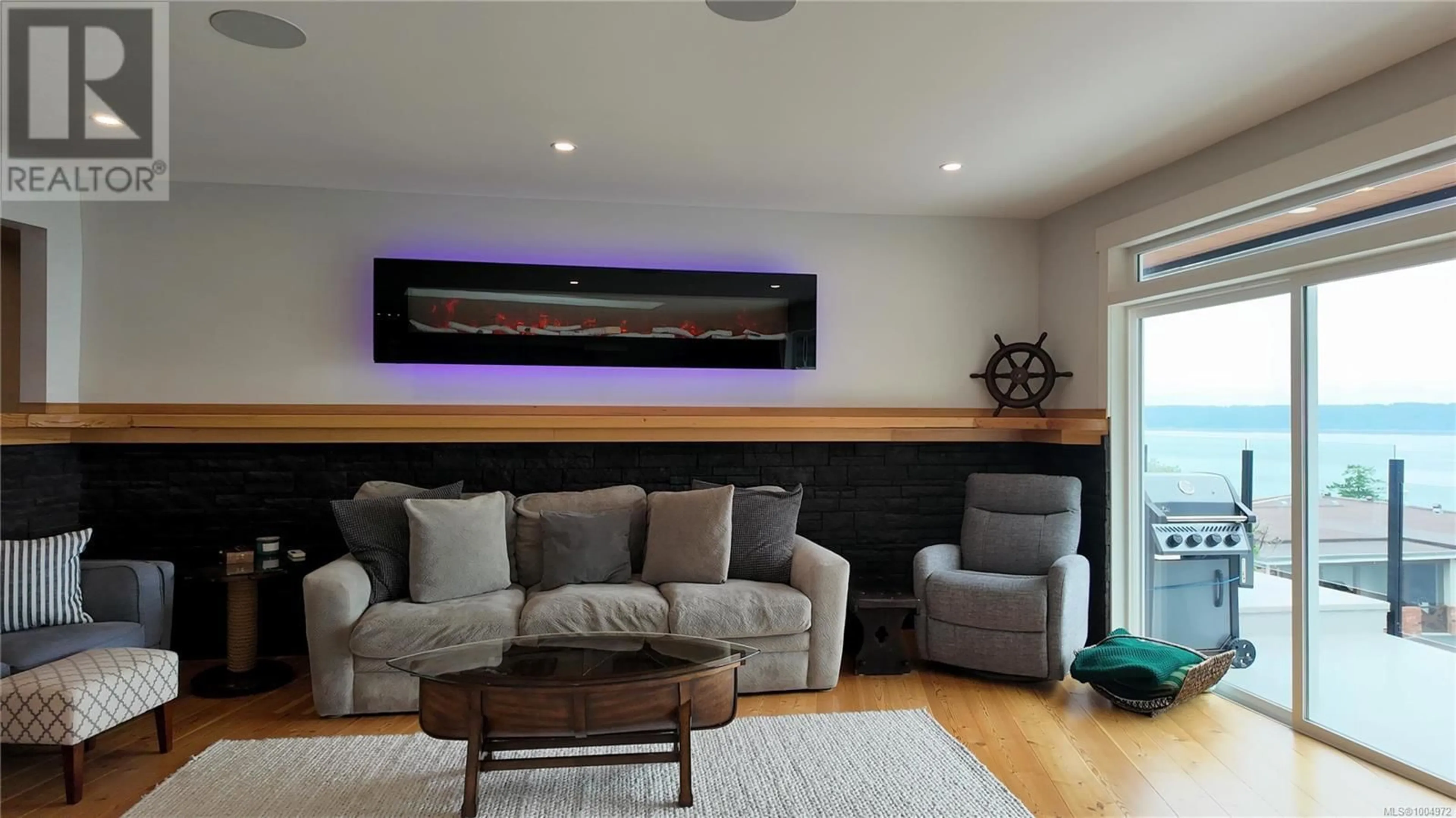 Living room with furniture, wood/laminate floor for 699 GALERNO ROAD, Campbell River British Columbia V9W5X4