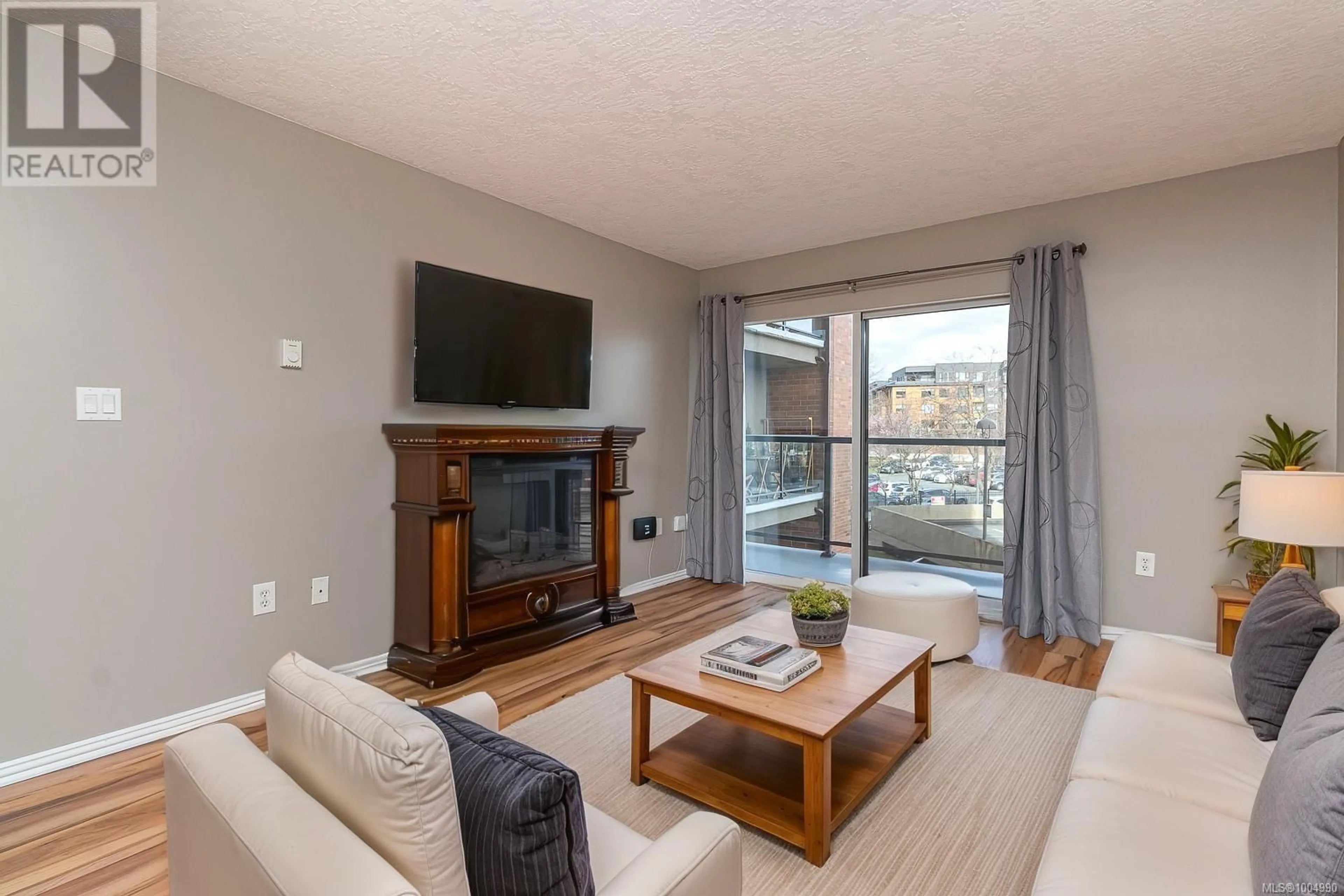 Living room with furniture, wood/laminate floor for 301 - 103 GORGE ROAD EAST, Victoria British Columbia V9A6Z2