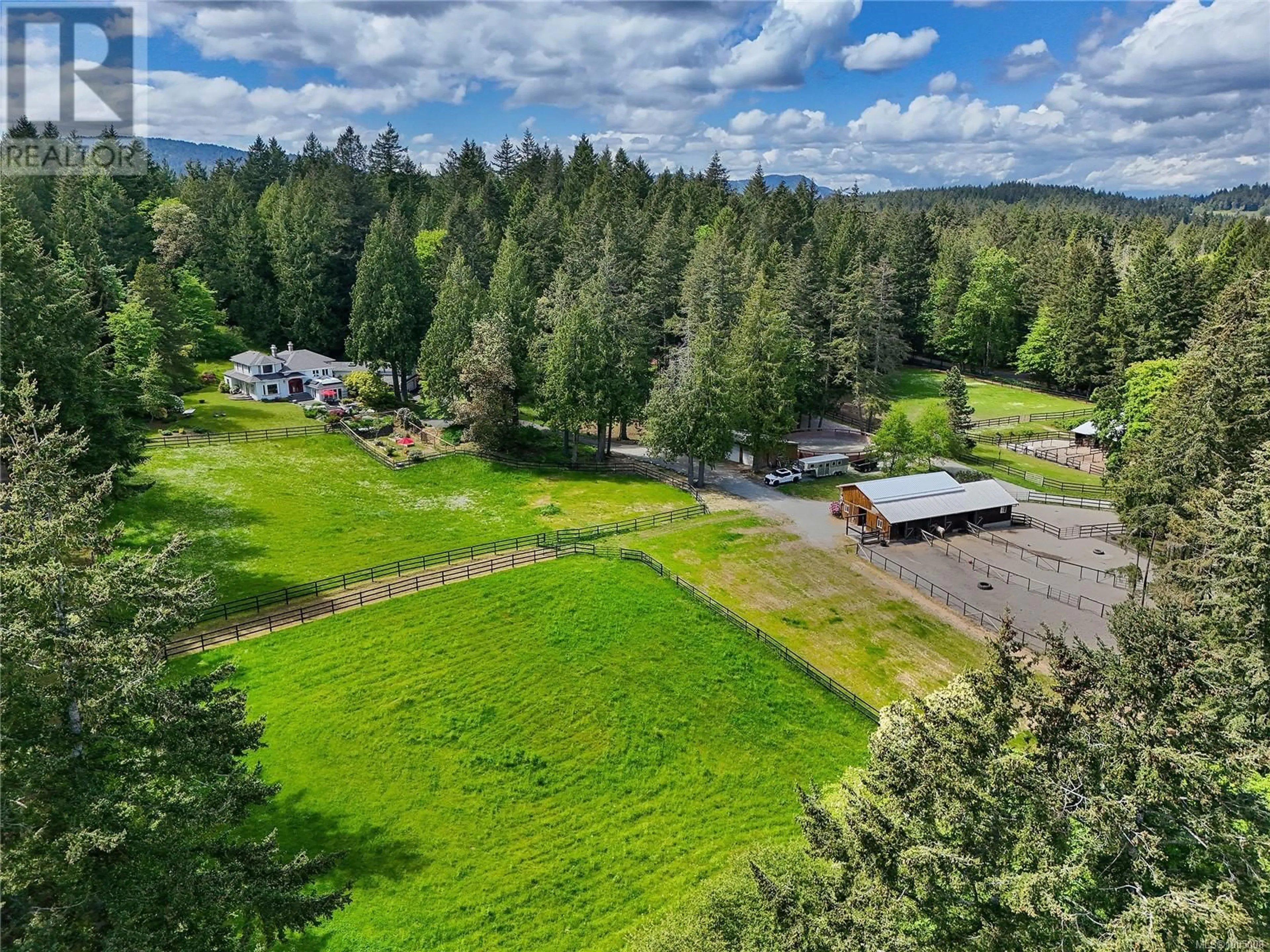 A pic from outside/outdoor area/front of a property/back of a property/a pic from drone, forest/trees view for 547 ELKWOOD ROAD, Saanich British Columbia V9E2A8