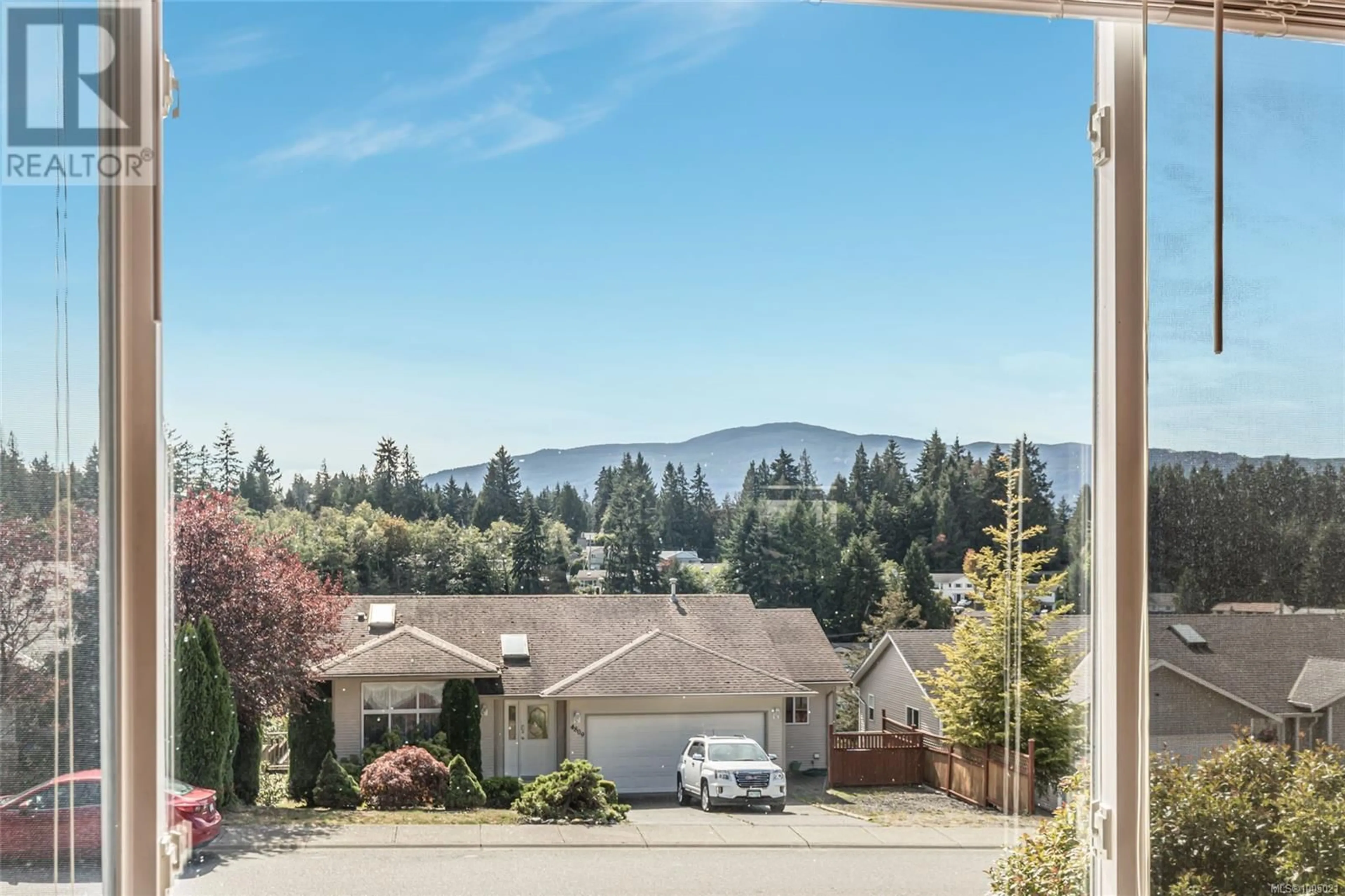 A pic from outside/outdoor area/front of a property/back of a property/a pic from drone, mountain view for 4808 FAIRBROOK CRESCENT, Nanaimo British Columbia V9T6M6