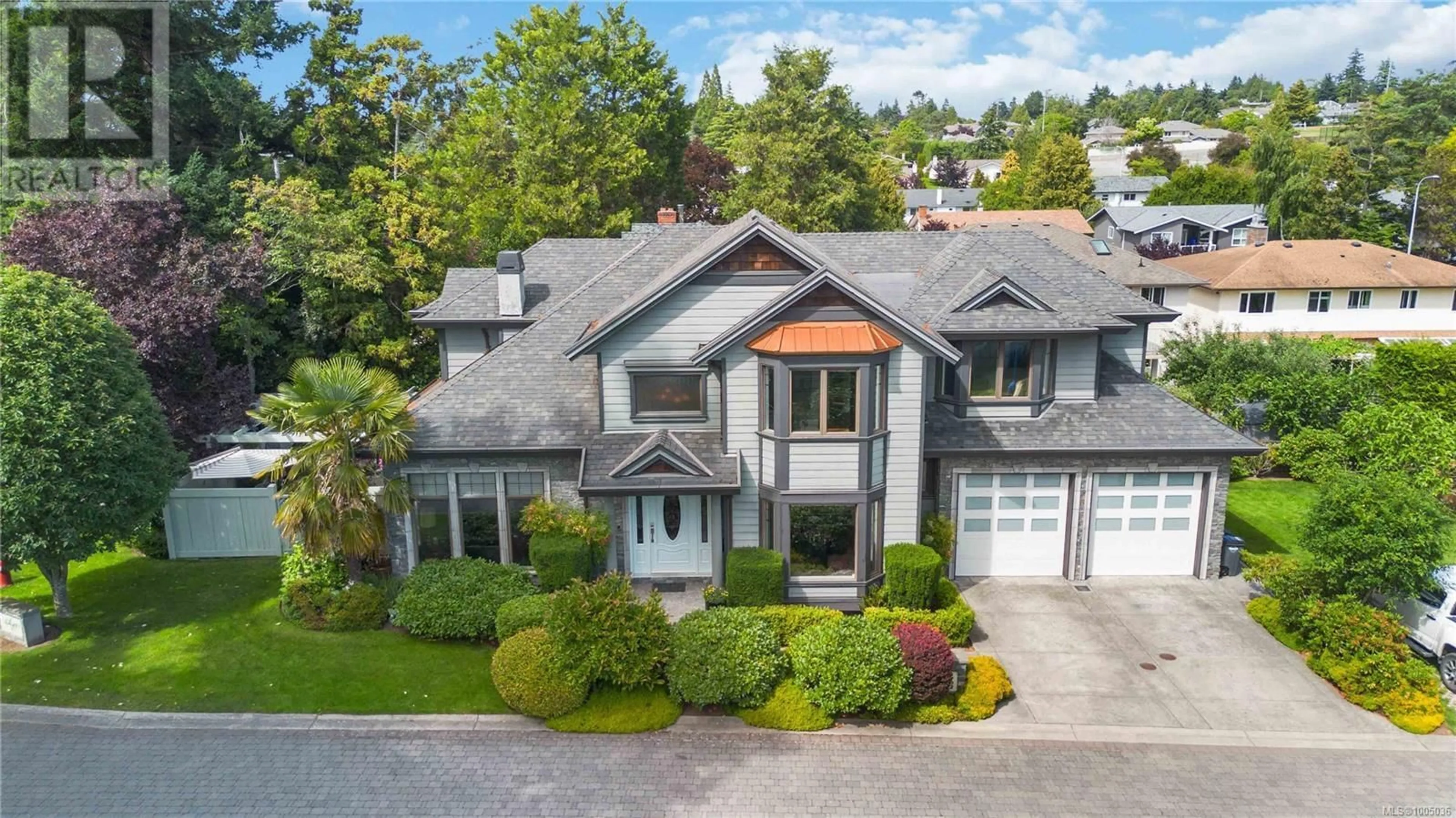 A pic from outside/outdoor area/front of a property/back of a property/a pic from drone, street for 1702 DE SOUSA PLACE, Saanich British Columbia V8N3L2